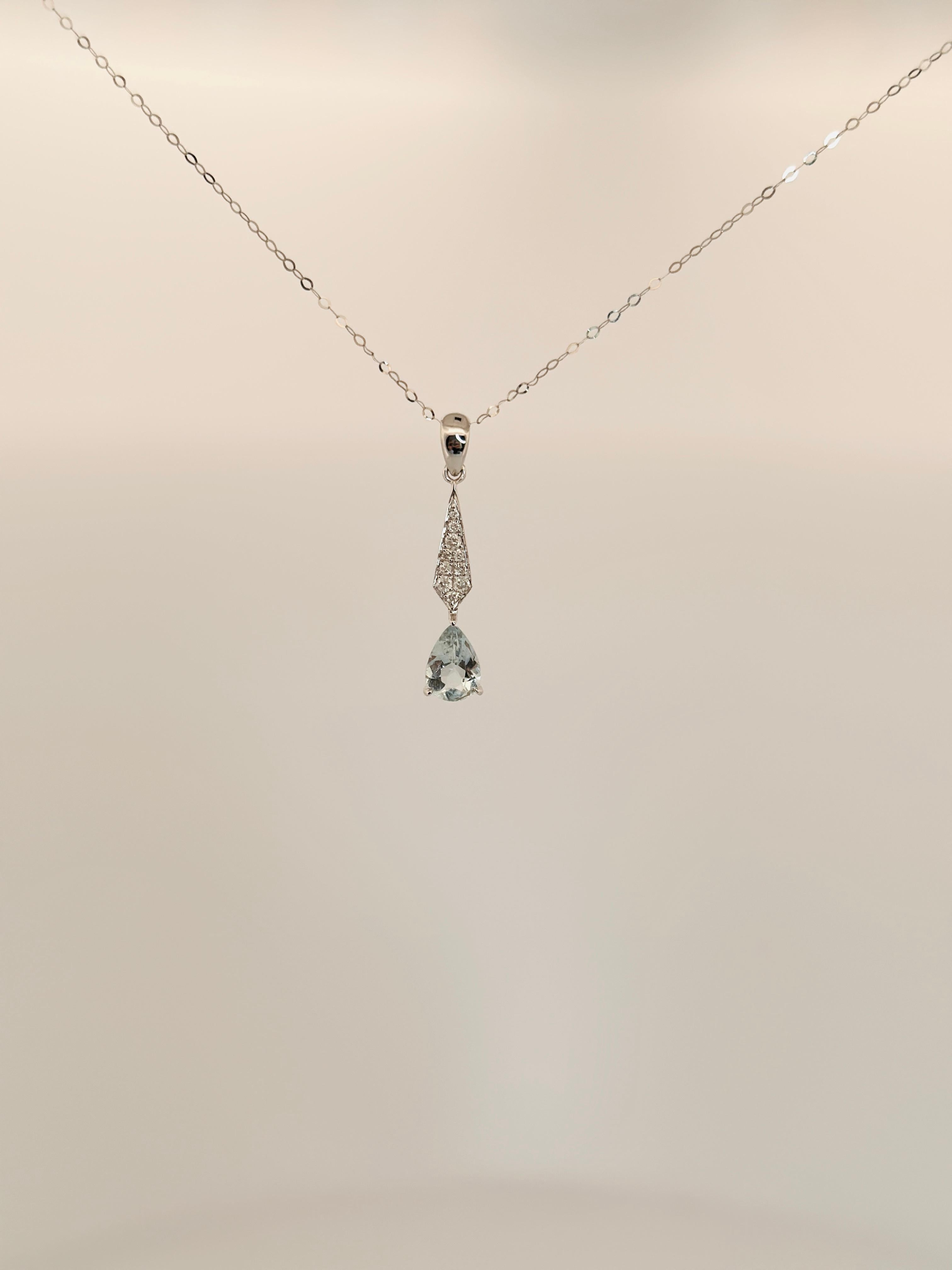 An 18k gold diamond and aquamarine teardrop pendant necklace is a piece of jewelry that is made of 18 karat gold and features a teardrop-shaped aquamarine stone with diamonds. The aquamarine stone is usually a pale blue color and the diamonds are