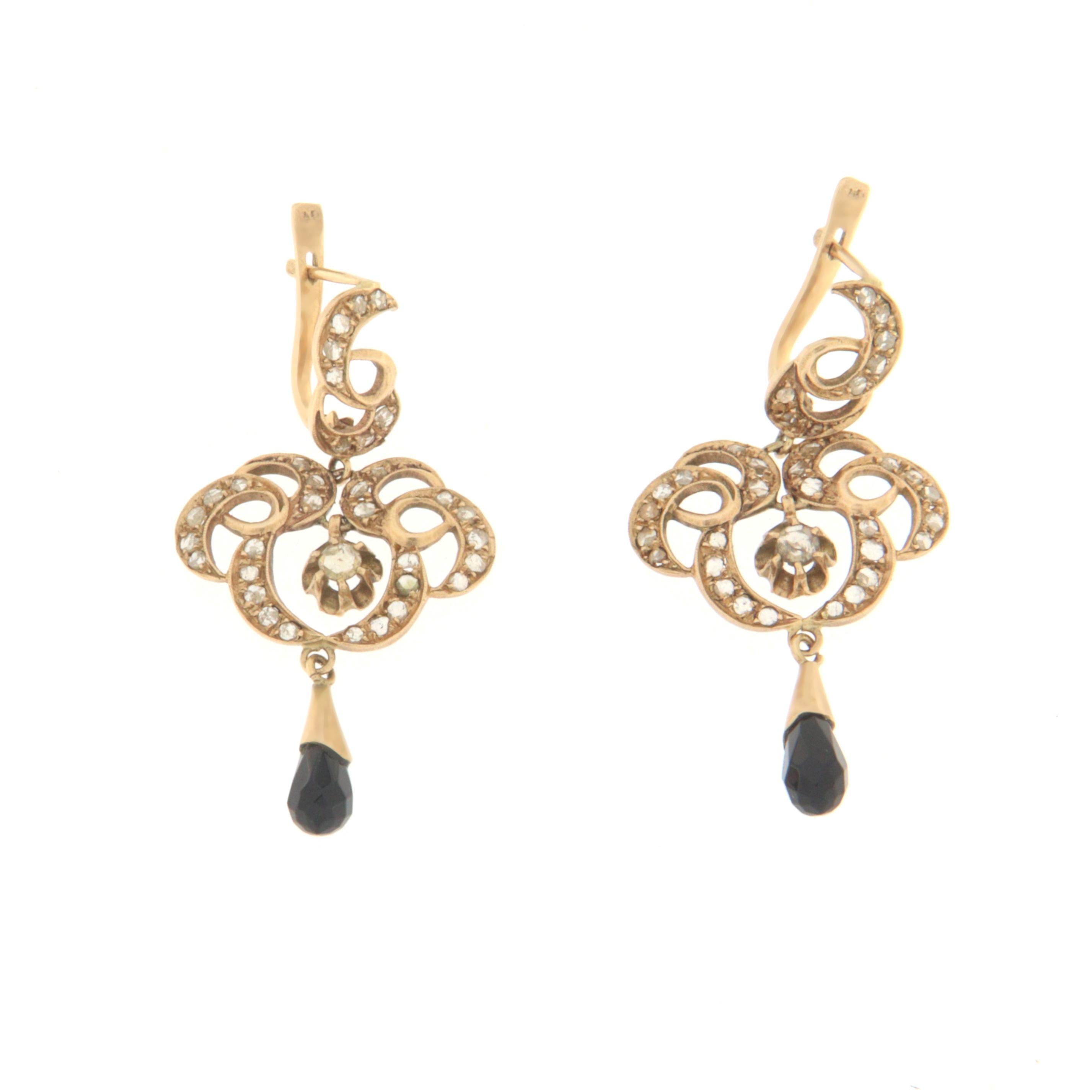 Antique 9 karat yellow gold drop earrings. Handmade by artisans assembled with rose cut diamonds and drop onyx

Earrings total weight 9.90 grams