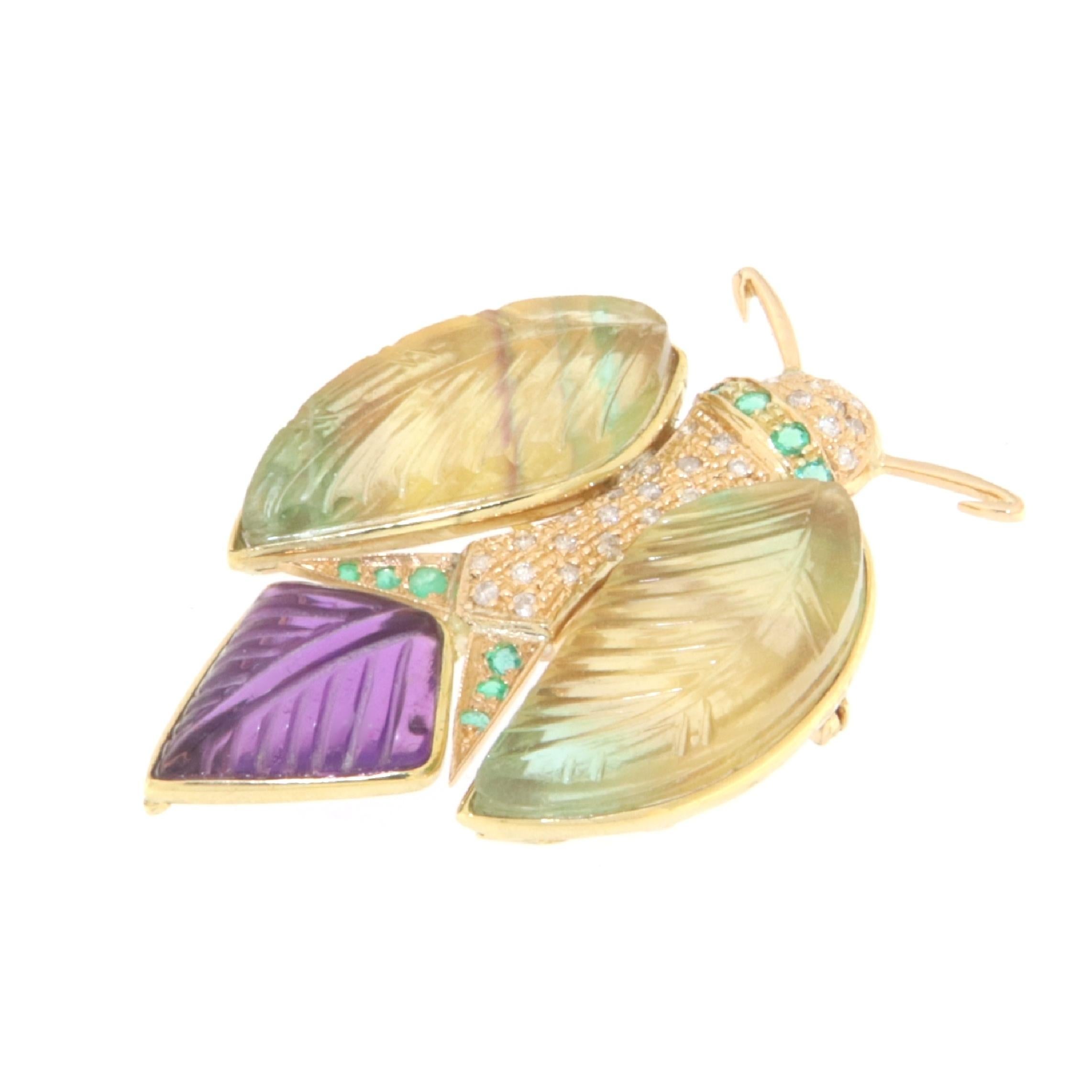 Graceful brooch depicting a butterfly with closed wings made of 18k yellow gold, on the small body is set with diamonds and emeralds, the wings are made up of two pairs of engraved citrines while the tail is an engraved  amethysts.

A jewel to wear