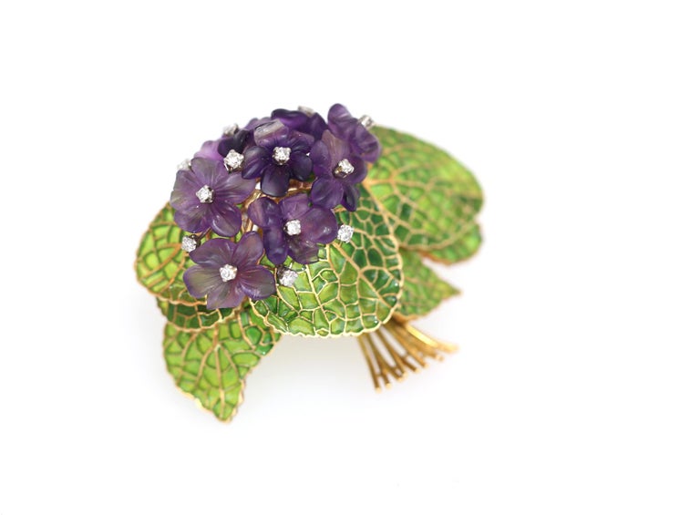 Diamonds Amethyst Violet Plique-a-jour enamel flower brooch. A true masterpiece of European jewelery. The special technique of Plique-a-jour enamel deep green colour is truly amazing. It is transparent and gives a superb feeling of tender natural