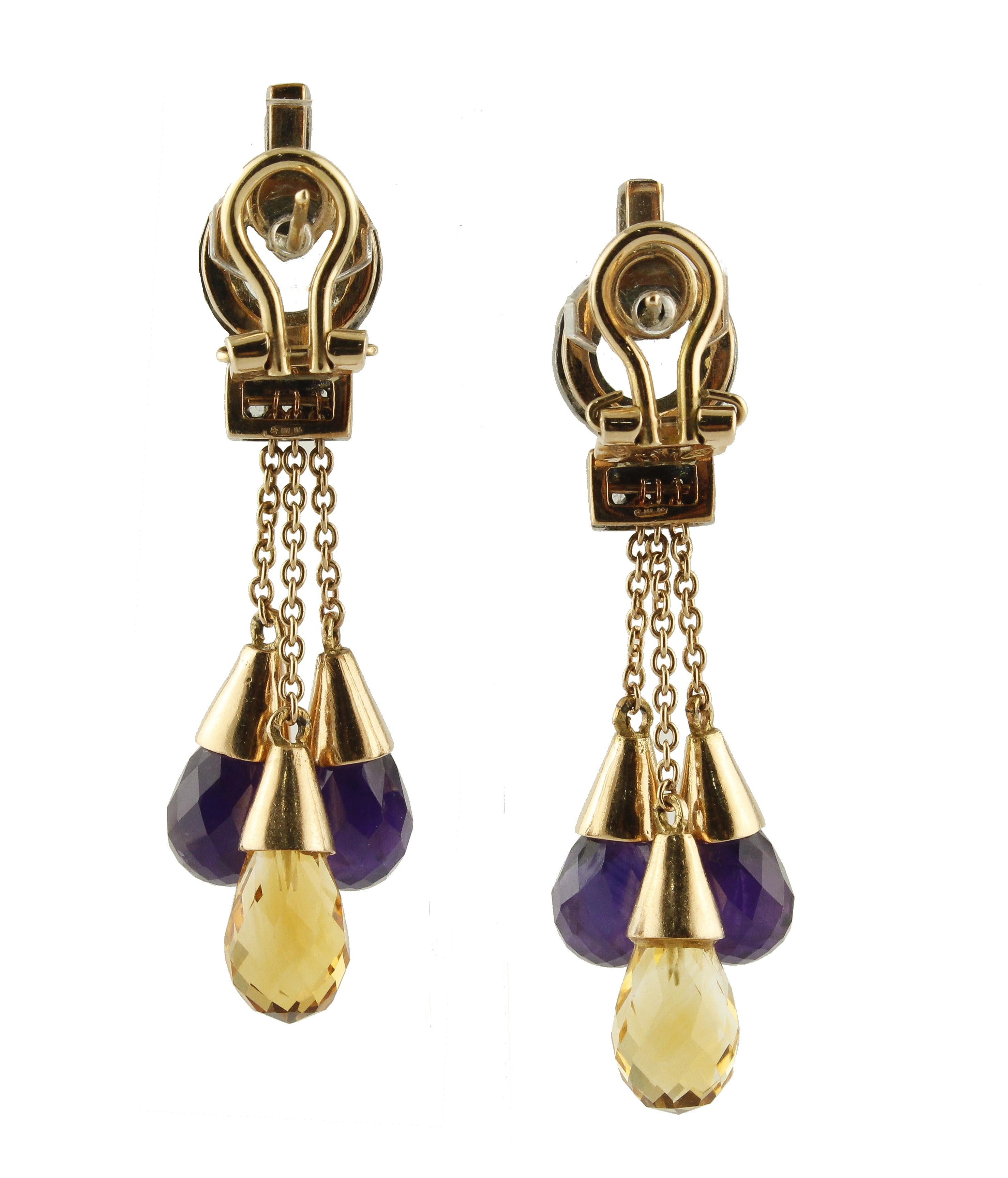 Fantastic chandelier earrings in 14K rose gold and silver structure mounted with diamonds yellow topaz and amethyst and yellow topaz drops
Diamonds 0.15 ct 
Amethyst and Yellow Topaz 25.13 ct 
Total Weight 17.80
R.F +gora
Length 5.7 cm 

For any