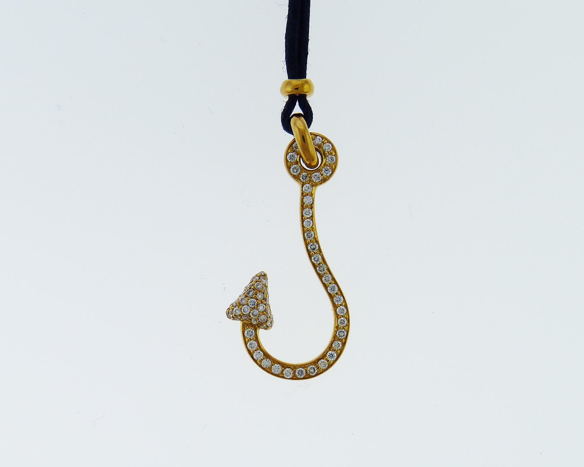 Modern cord necklace with an anchor pendant embellished with white diamonds and set in 18K yellow gold. 
Total weight of diamonds is 0.41 carats.
The length of the cord is 15 inches.
The length of the pendant is 1.3 inches.
Weight is 4 grams.