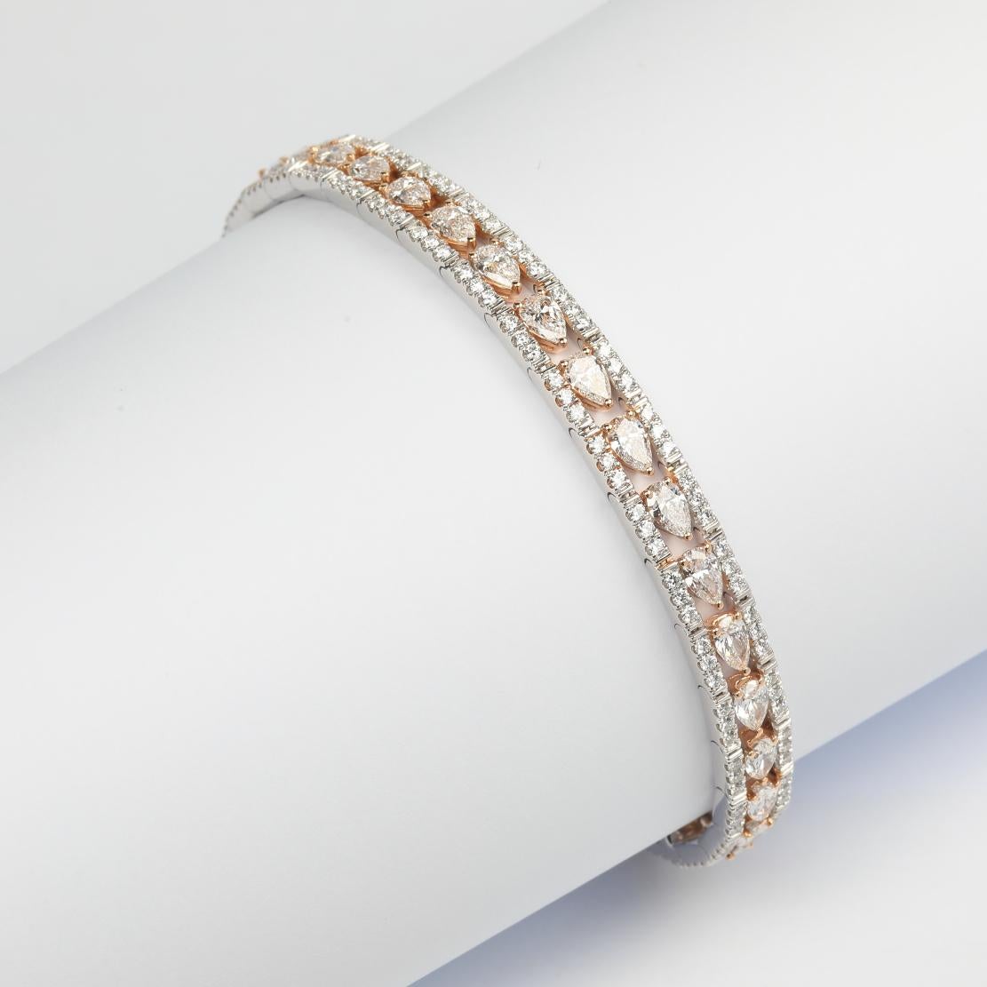 Beautiful Diamond Stationed Tennis Bracelet, featuring:
✧ 38 pear shape natural diamonds F-G color VS+ weighing 5.19 carats
✧ 204 round cut natural diamonds F-G color VS+ weighing 2.00 carats
✧ Approximately 23 grams of 18K White and Rose Gold
✧