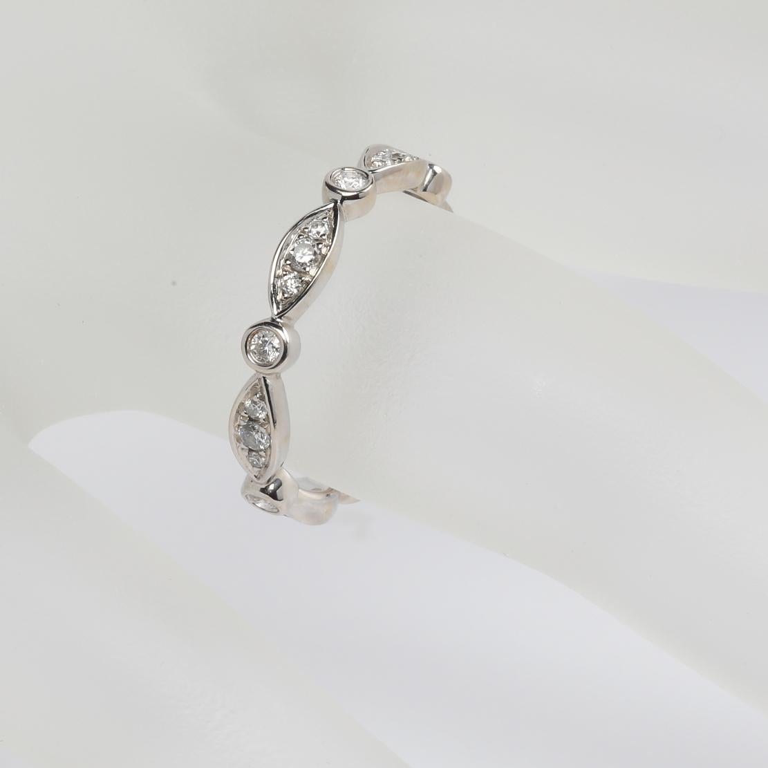 Beautiful Stackable Bezel Set Diamond Wedding Band Ring, featuring:
✧ Prong set natural diamonds weighing 0.45 tcw  (F-G color, VS clarity) 
✧ Approximately 2.60 grams of 18K White Gold
✧ Free appraisal included with your purchase
✧ Comes with