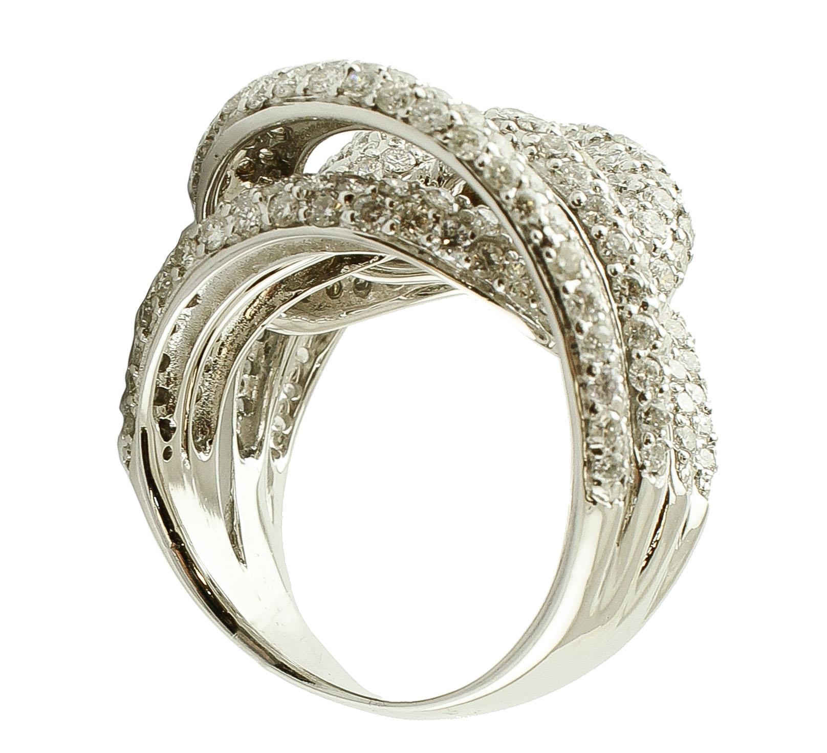 Brilliant Cut Diamonds and 18 Karat White Gold Intertwined Bands Ring For Sale