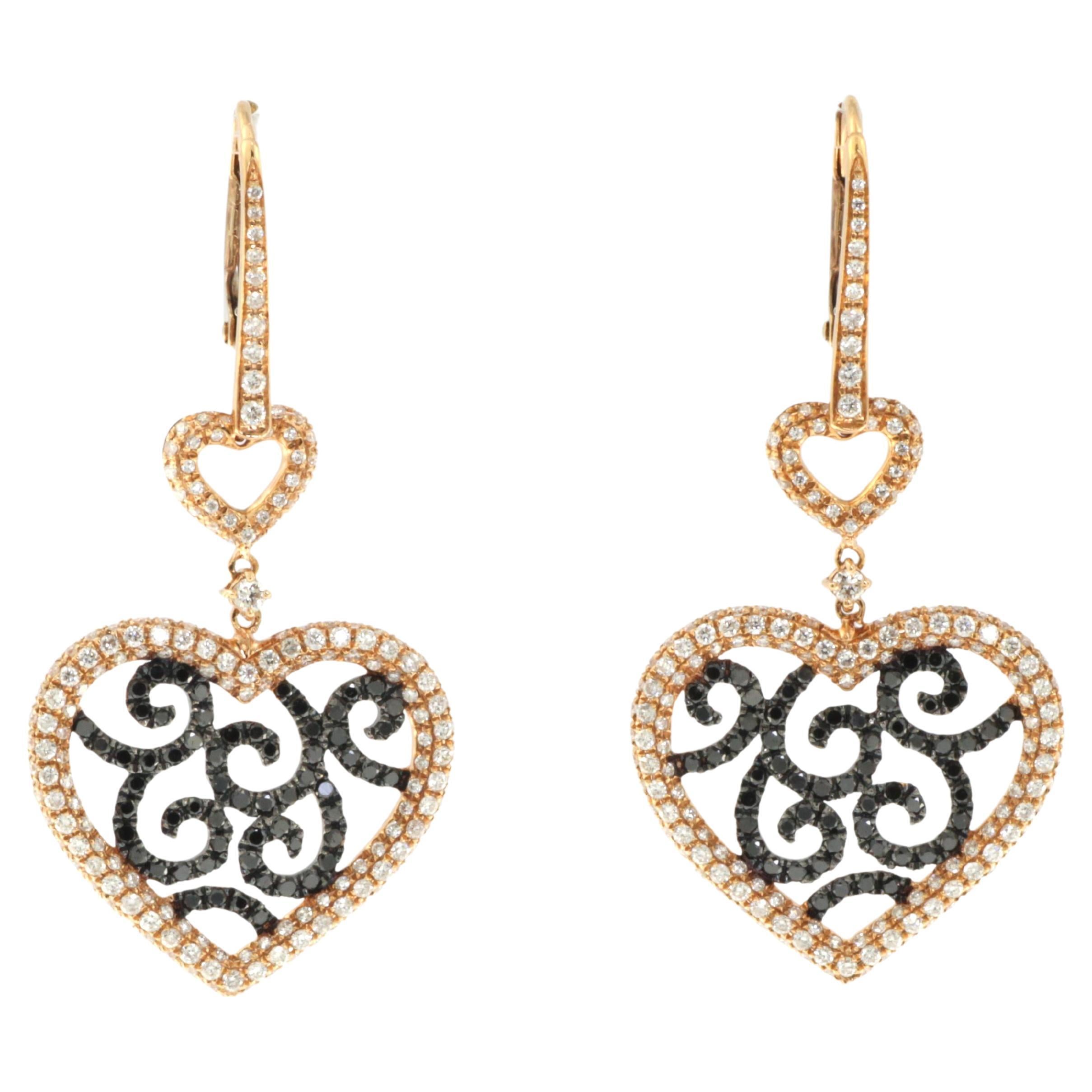 Art Deco White and Black Diamonds Heart Shape Dangle Earrings in 18k Rose Gold For Sale
