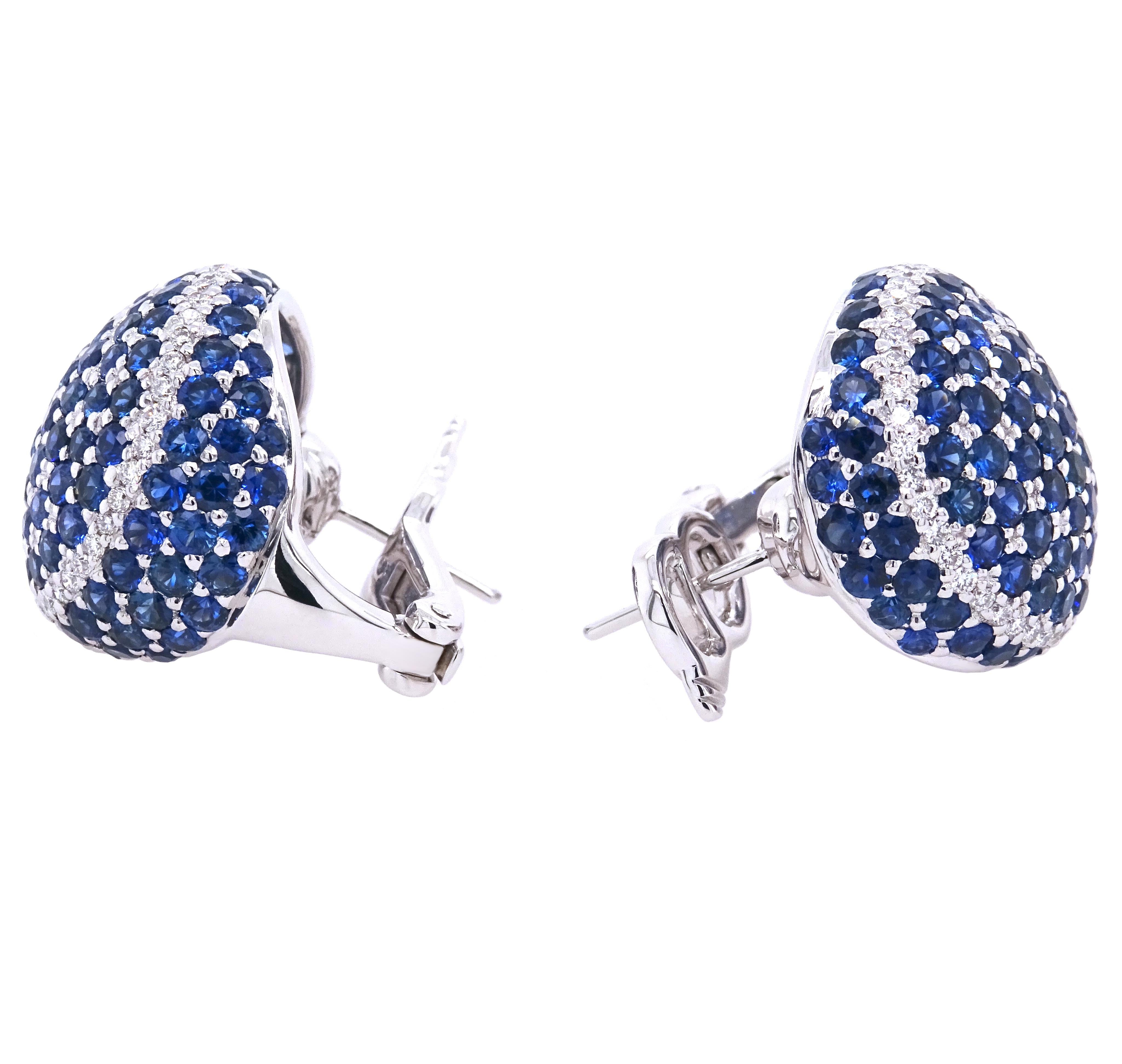 Embrace the timeless elegance of our exquisite 18K white gold earrings, adorned with a captivating combination of round blue sapphires and round white diamonds. The dazzling blue sapphires, totaling 9.62 carats, add a rich and alluring hue that