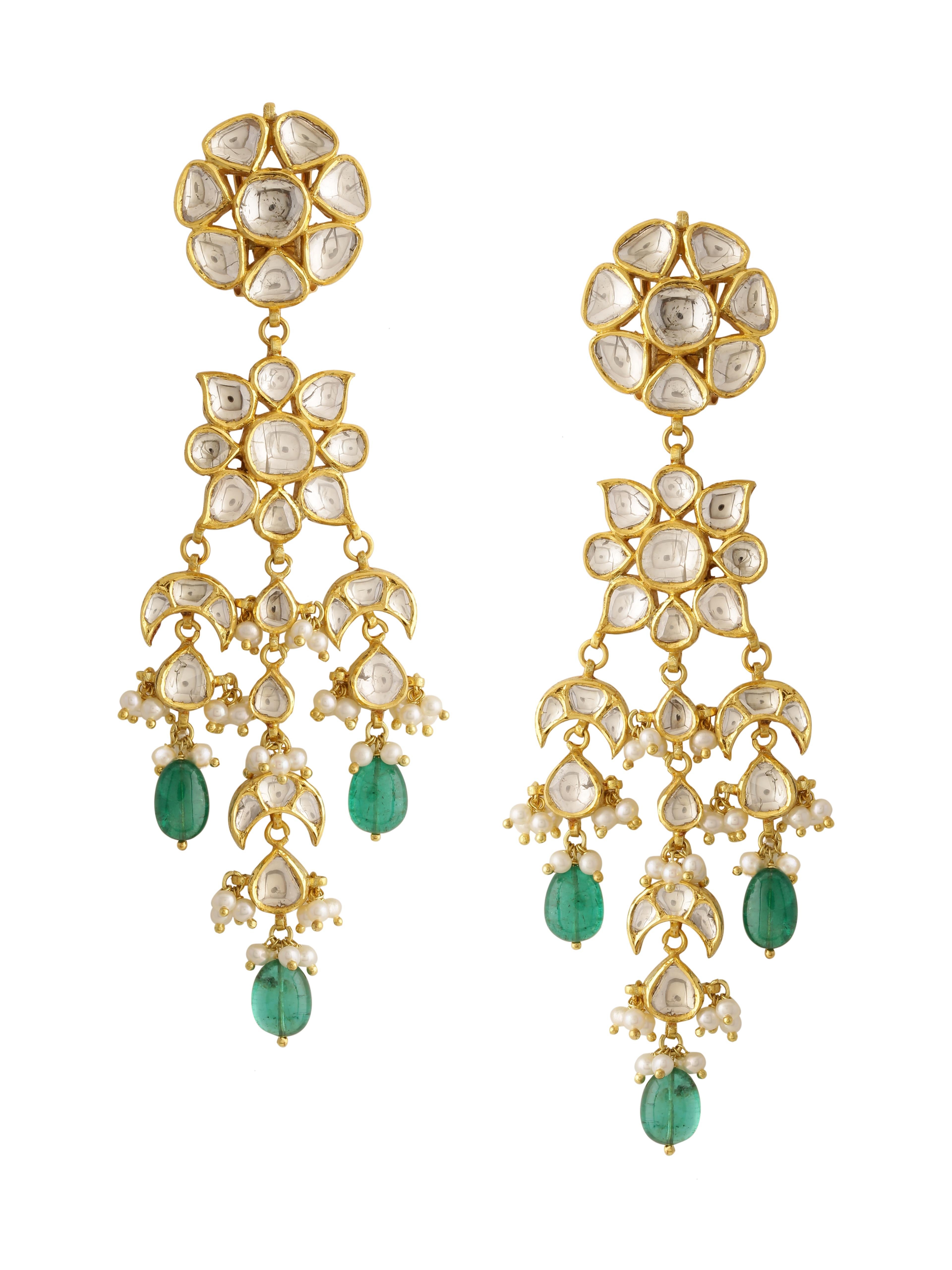 A pair of grand and beautiful earrings with uncut rose cut diamonds and Emerald Beads handcrafted in 18K Gold.
You will notice really fine enamel work at the back inspired by the old palaces of India. The art of enamelling is called 