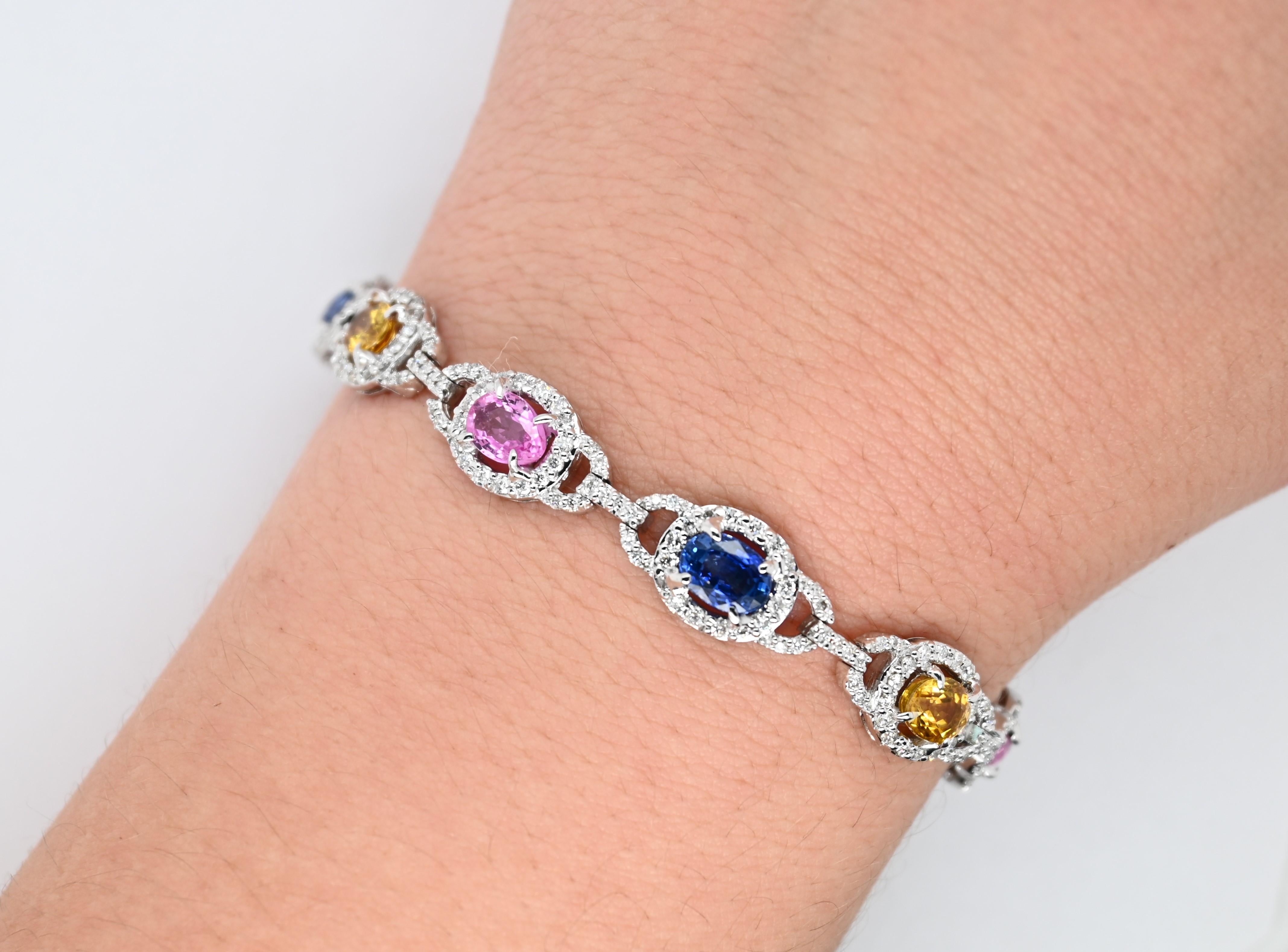 Original Magnum Creation diamond and mixed sapphire bracelet features 2.18 carats of white diamonds and 8.27 carats of mixed color sapphires, mounted on 14 karats whit gold.