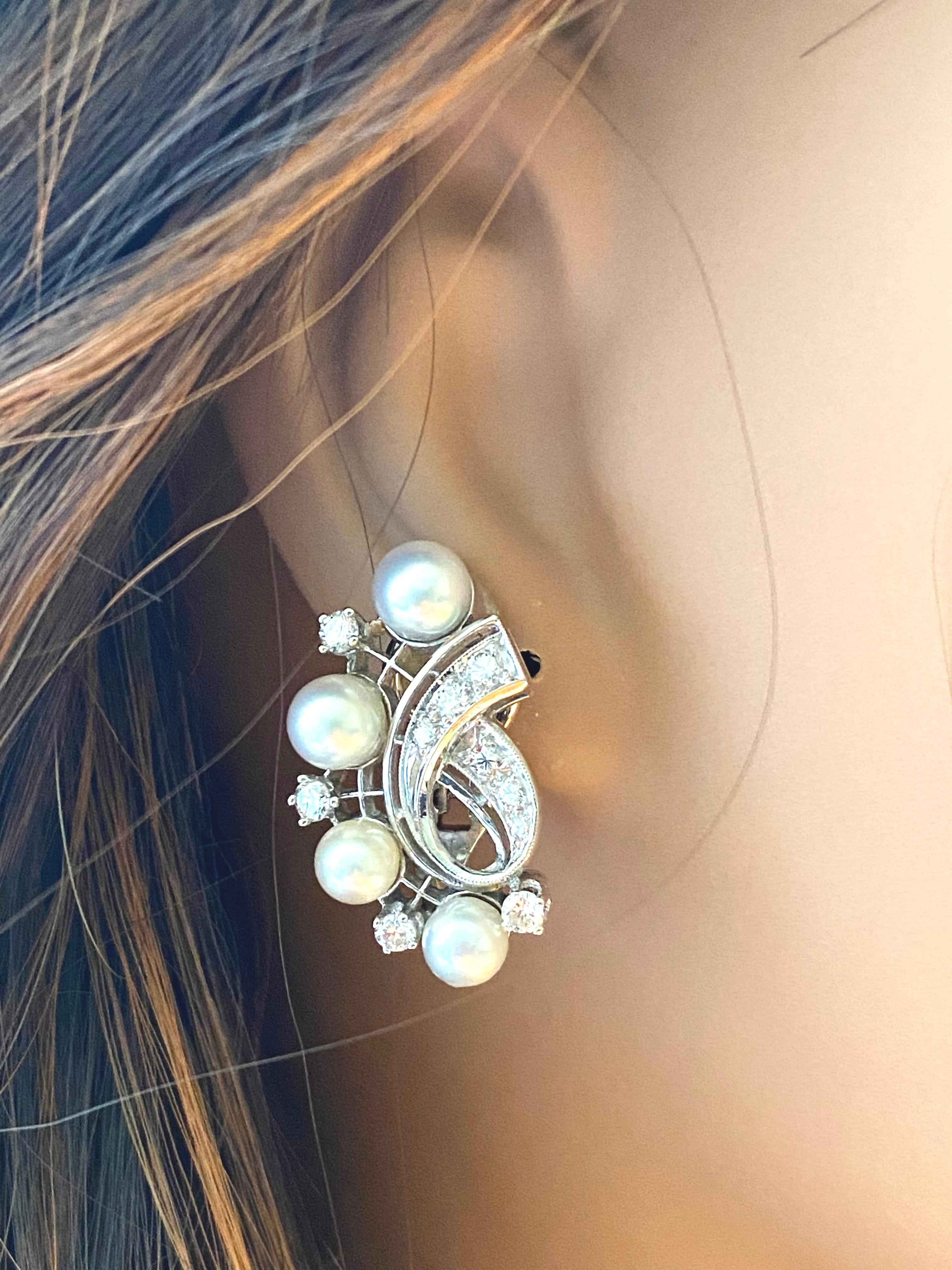 Introducing our exquisite Vintage Mid Century 14 Karat White Gold Diamonds and Pearls 0.75 Carat Clip On Earrings - a timeless piece that exudes elegance and sophistication. These one-inch earrings are a perfect blend of vintage charm and modern