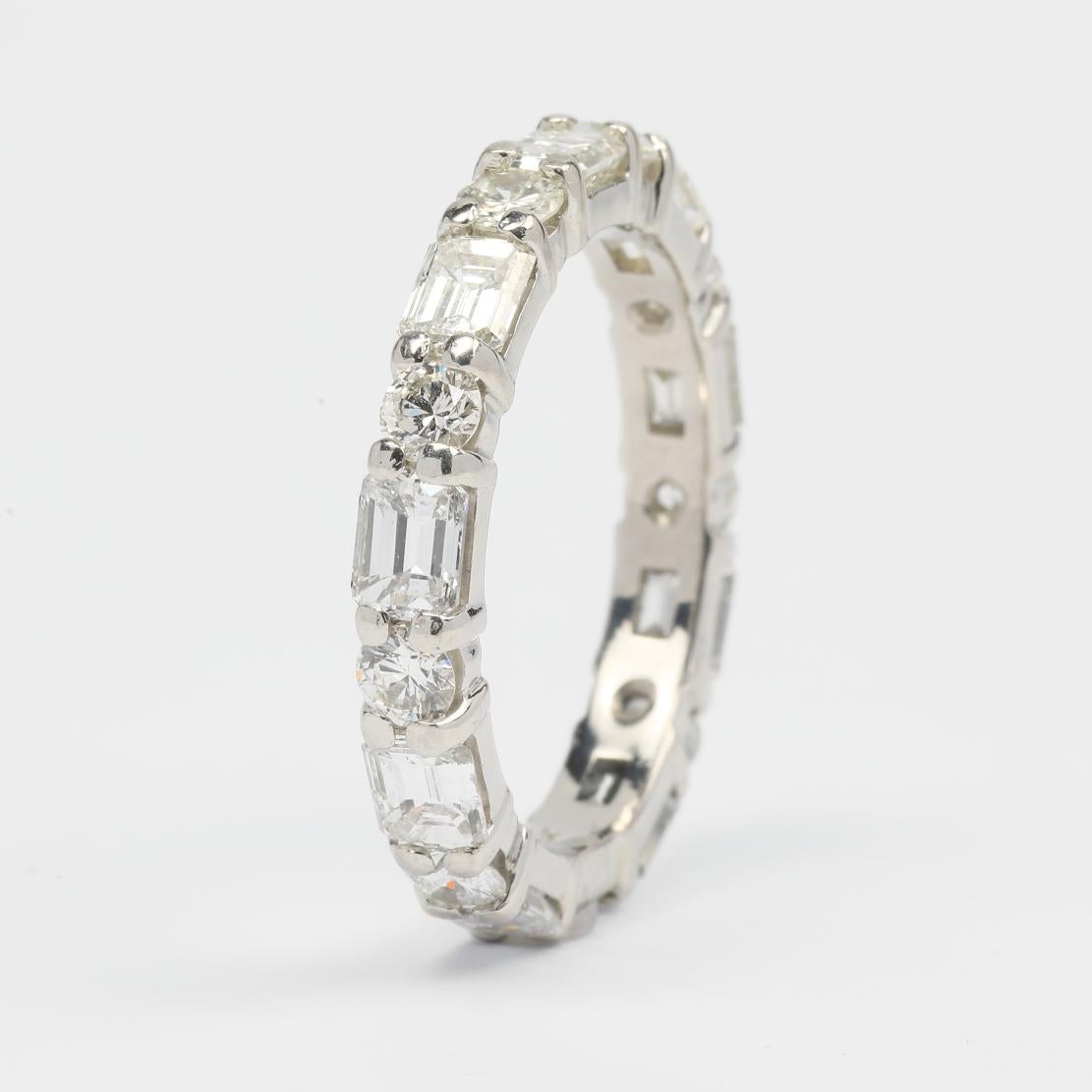 Classy Mixed Shaped Eternity Band Ring, featuring:
✧ Shared prong set natural diamonds weighing approx. 4.30 tcw  (F-G color, VS clarity)
✧ Approximately 5.80 grams of Platinum
✧ Free appraisal included with your purchase
✧ Comes with beautiful