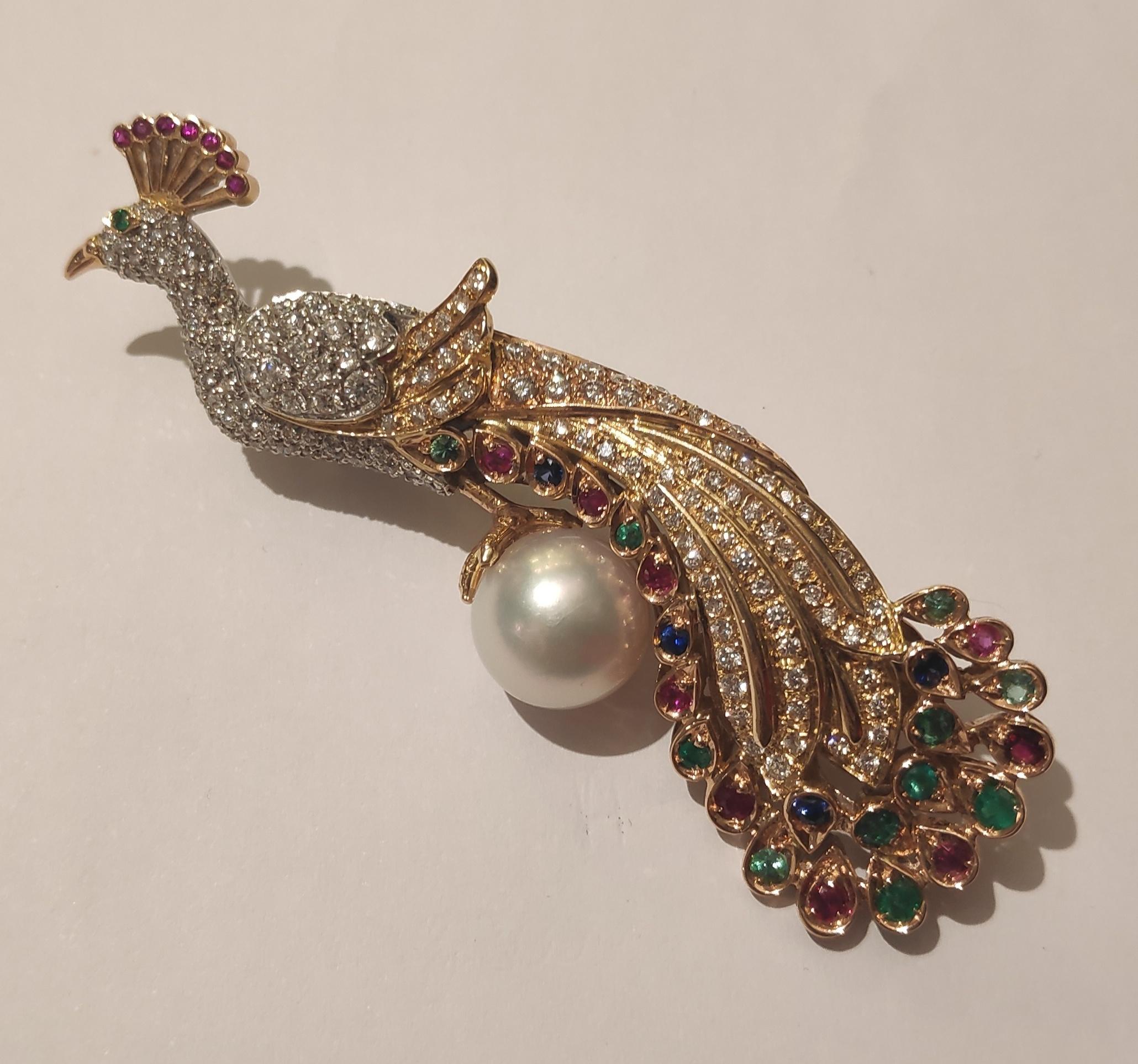 Diamonds and Precious Stones Peacock Brooch in yellow and withe gold 18kt
diamonds ct 2,20,Italian handcrafted.1990 
misurement:2cm x 8 cm
Australian pearl 12mm diameter.