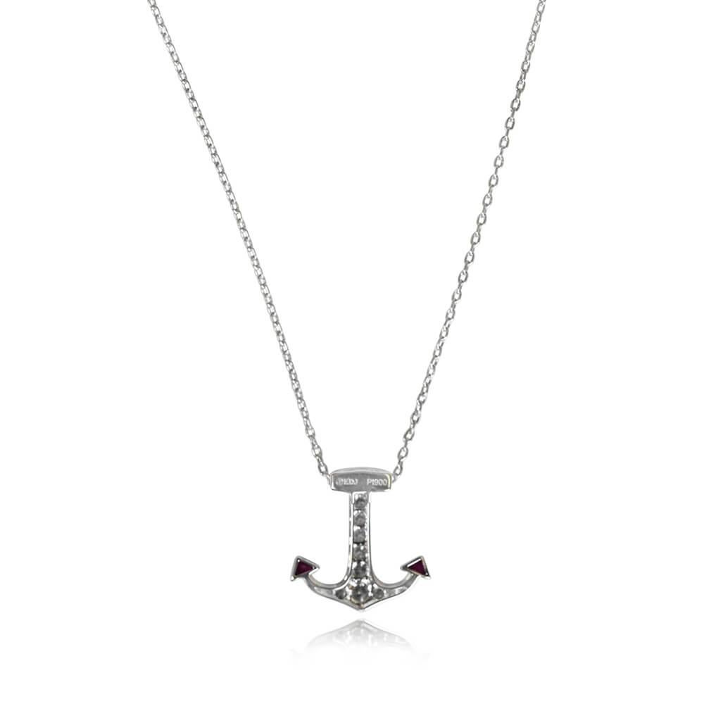 Embrace a nautical allure with this Art Deco-style pendant featuring a charming anchor motif. Round brilliant cut diamonds and French cut rubies are artfully set, with a total diamond weight of about 0.35 carats and a total ruby weight of around