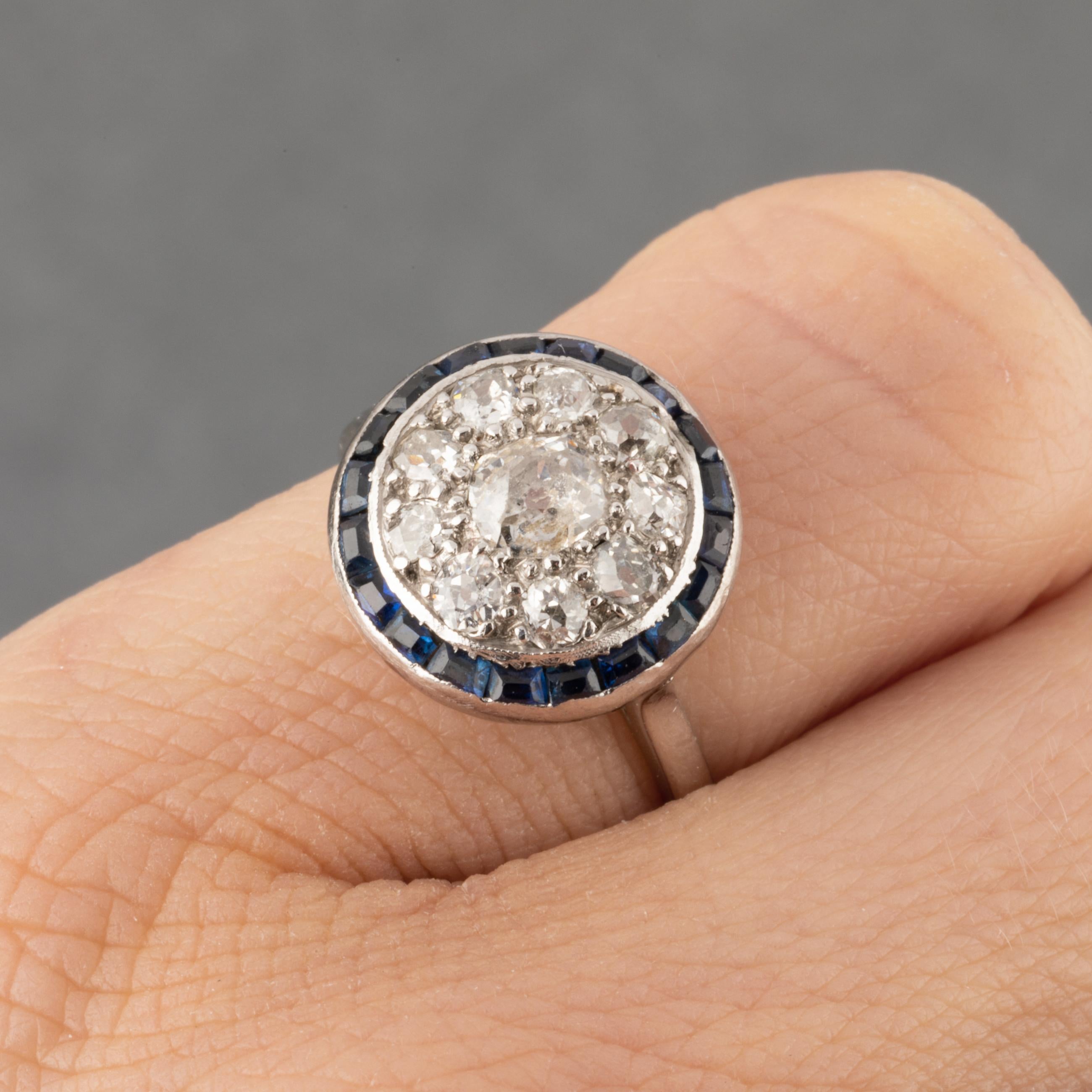 One very lovely antique ring, made in France circa 1920.
Made in white gold 18k (eagle head hallmark partly, Owl). 
The diamonds are Old European cut diamonds. 0.70/0.80 carats approximately.
The diameter of the front is 12mm.
Ring size is 49 or