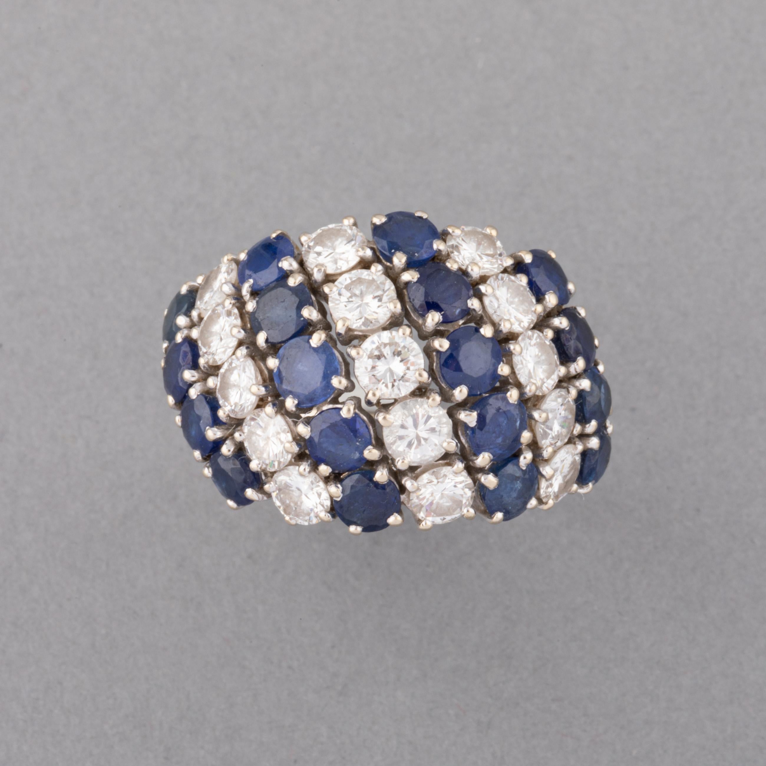 One very lovely vintage ring, made in France circa 1960.
Made in white gold 18k and set with beautiful diamonds and sapphires. The diamonds weights approximately 2.50 carats of good quality.
Ring size is 52 or 6 usa.
Weight:3.23 grams