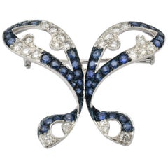 Broche papillon en or blanc avec diamants et saphirs, Italie