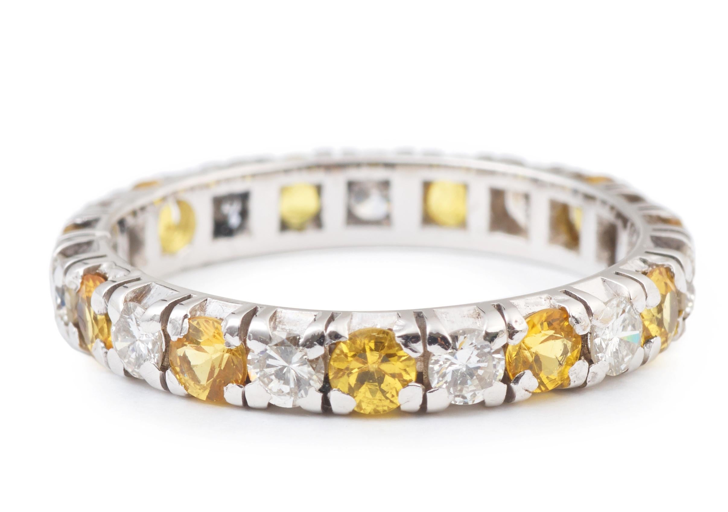 Ring set with 11 round cut yellow sapphires and 11 brillant cut diamonds.

Weight od the diamonds : approx 0.33 cts 

Weight of the sapphires : approx 0.44 cts 

18 carats white gold, 750/000th

Size of the ring : 52 fr (6 us)

Dimensions of the