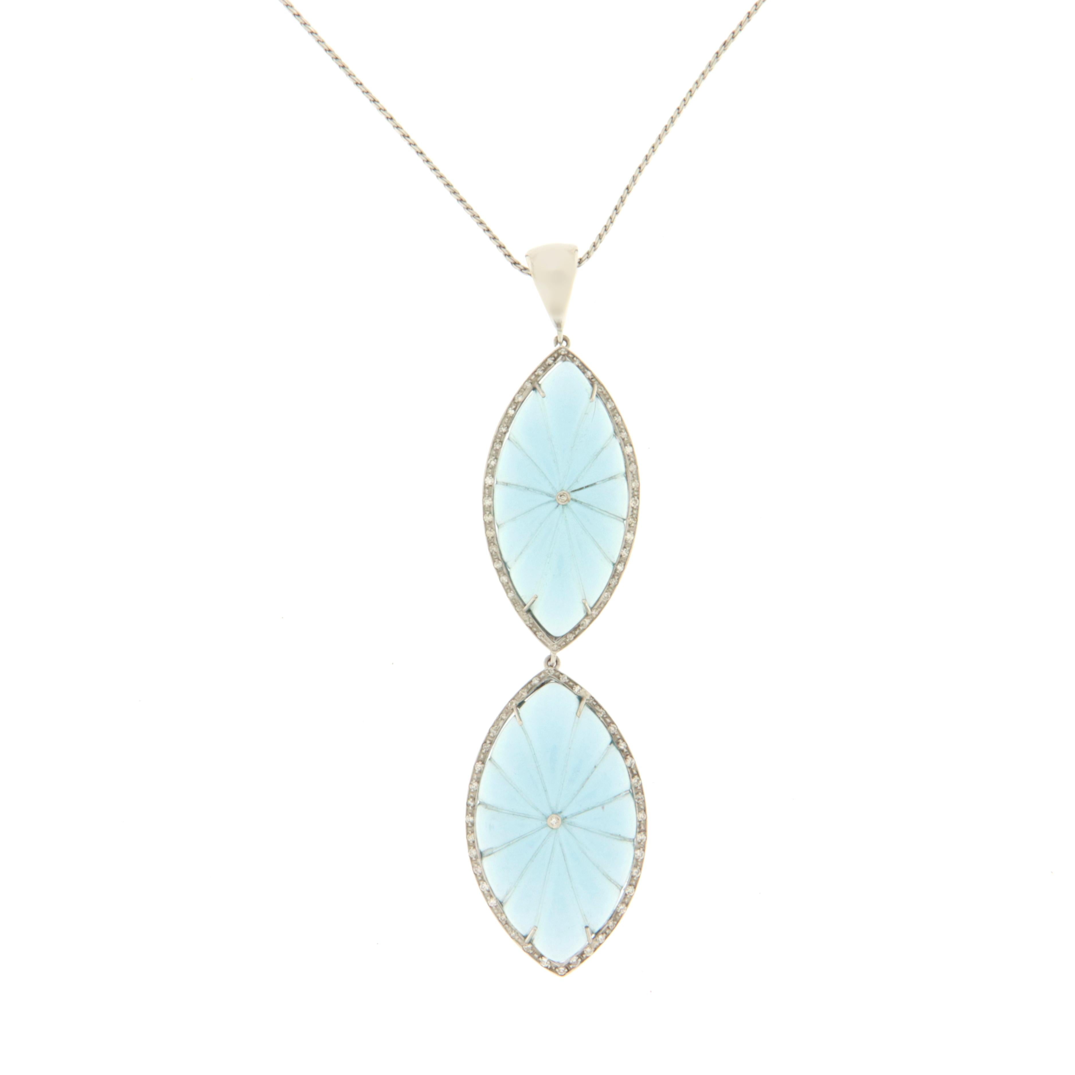 Fantastic necklace made entirely by hand in 18 karat white gold with two marquise-cut blue quartzes in the upper and lower part surrounded by natural diamonds.

A particular jewel of its kind, lively in colors and at the same time easy to wear for