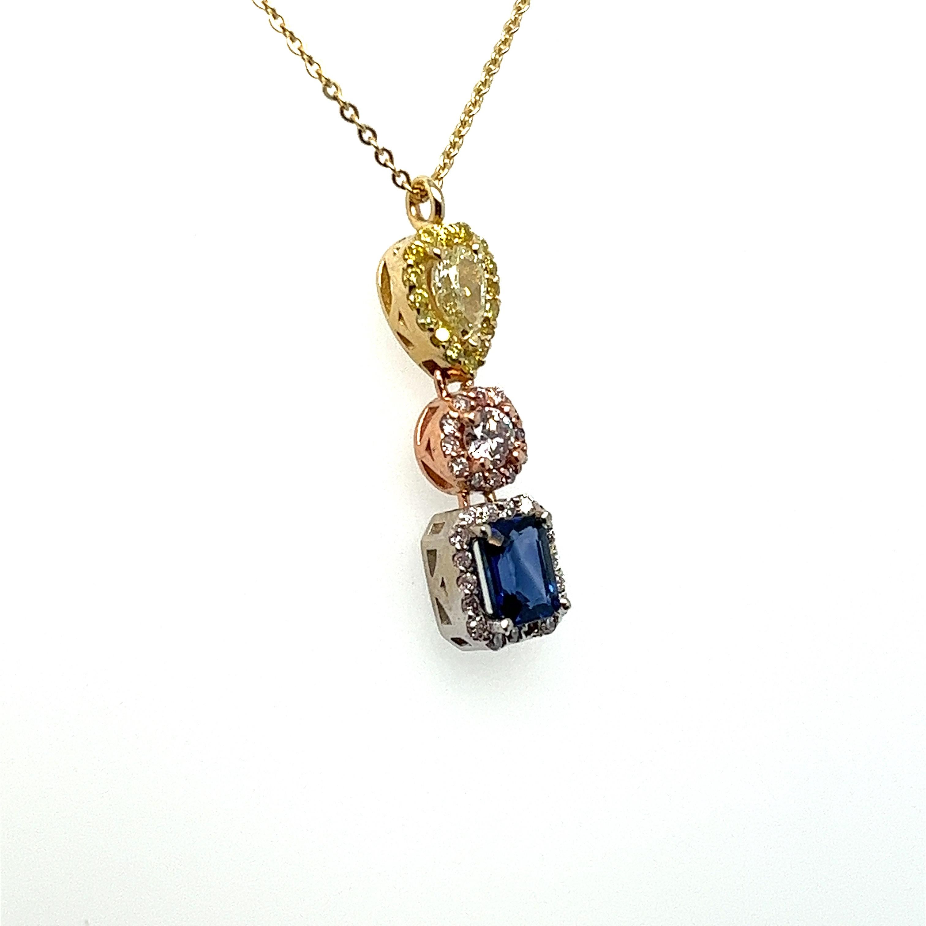 Opulent pendant made with a variety shaped natural earth mined yellow, pink, white diamonds and blue sapphire.
Pendant is handmade in solid 14kt yellow, white and rose gold on a slender yellow gold adjustable chain 16
