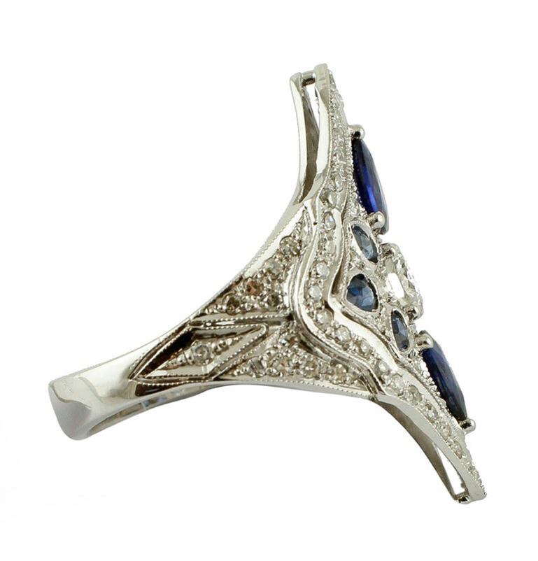 Vintage ring in 14k white gold designed with a rhombus- shaped head structure studded with beautiful white diamonds and intense blue sapphires
The origin of this ring goes back to the 1970s, it was created and totally handmade by Italian master