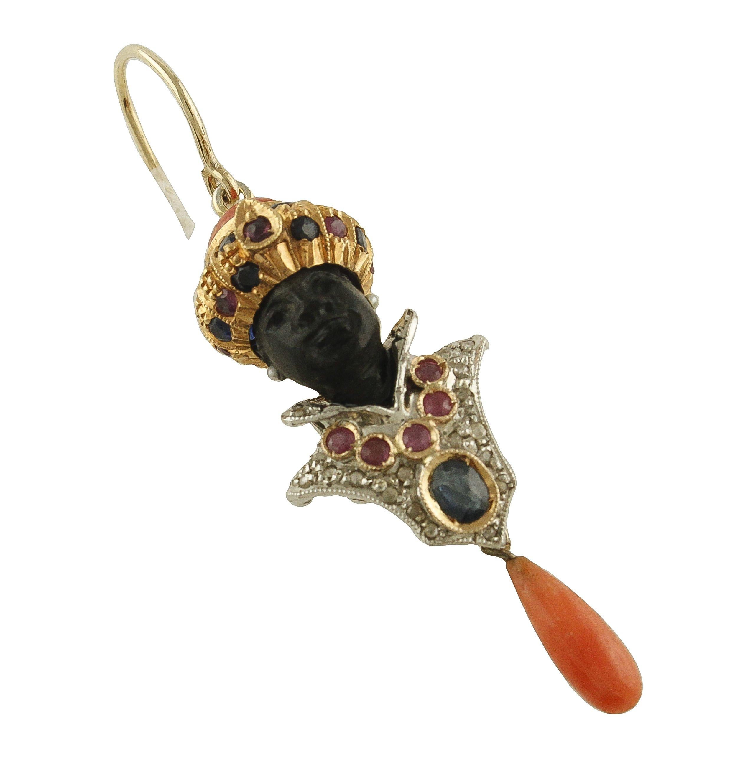 Gorgeous Moretto earrings in 9K rose gold and silver mounted with ebony face, micro-pearls as earrings, the hat is studded by blue sapphires and rubies and coral botton on the top; instead the chest is embellished by beautiful white diamonds,