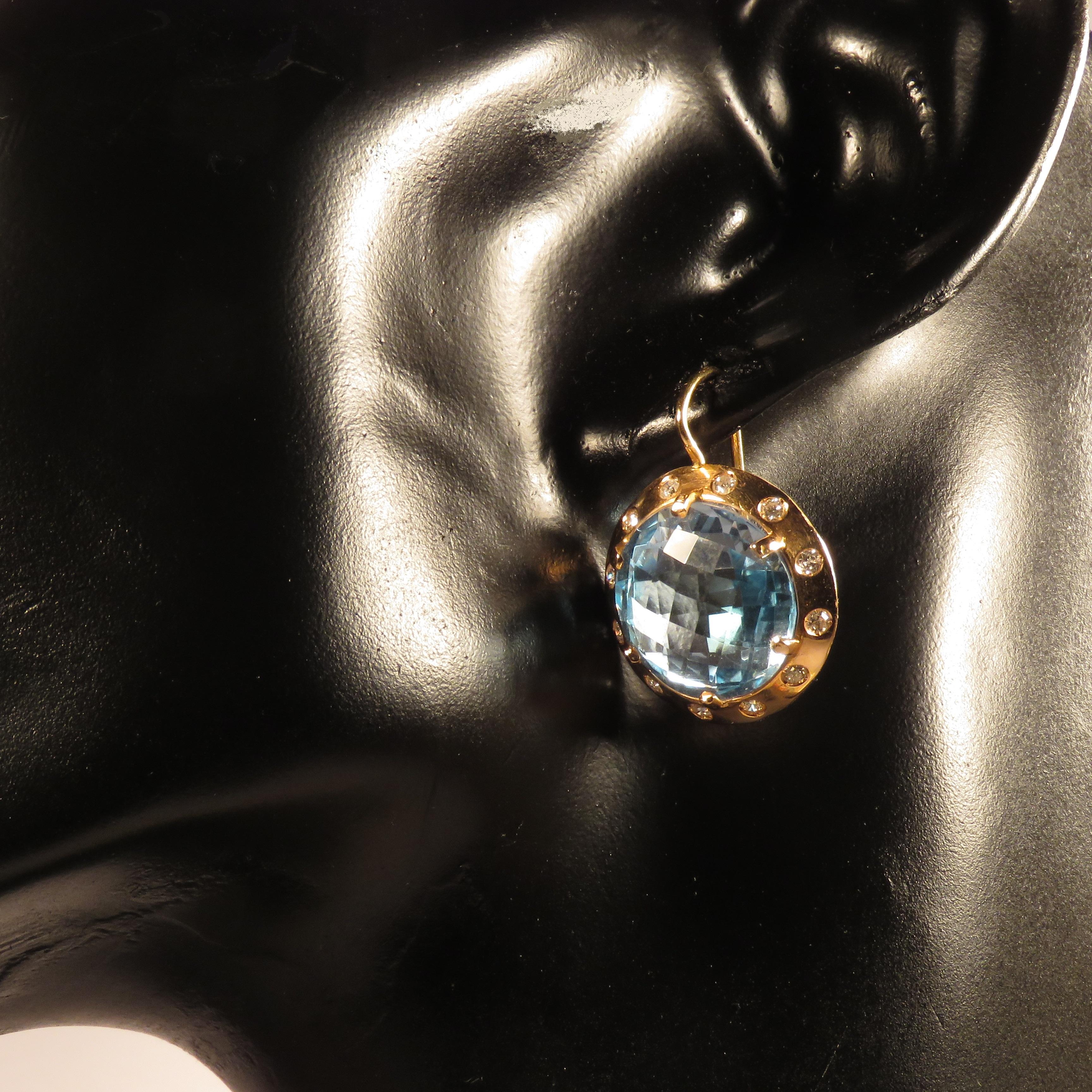 Wonderful lever-back earrings in 18 karat rose gold featuring 0.30 ctw diamonds totally and two vivid blue faceted topaz with the diameter of 15 mm / 0.590 inches. 
Handmade in Italy by Botta Gioielli. Marked with the Italian gold mark 750 and Botta