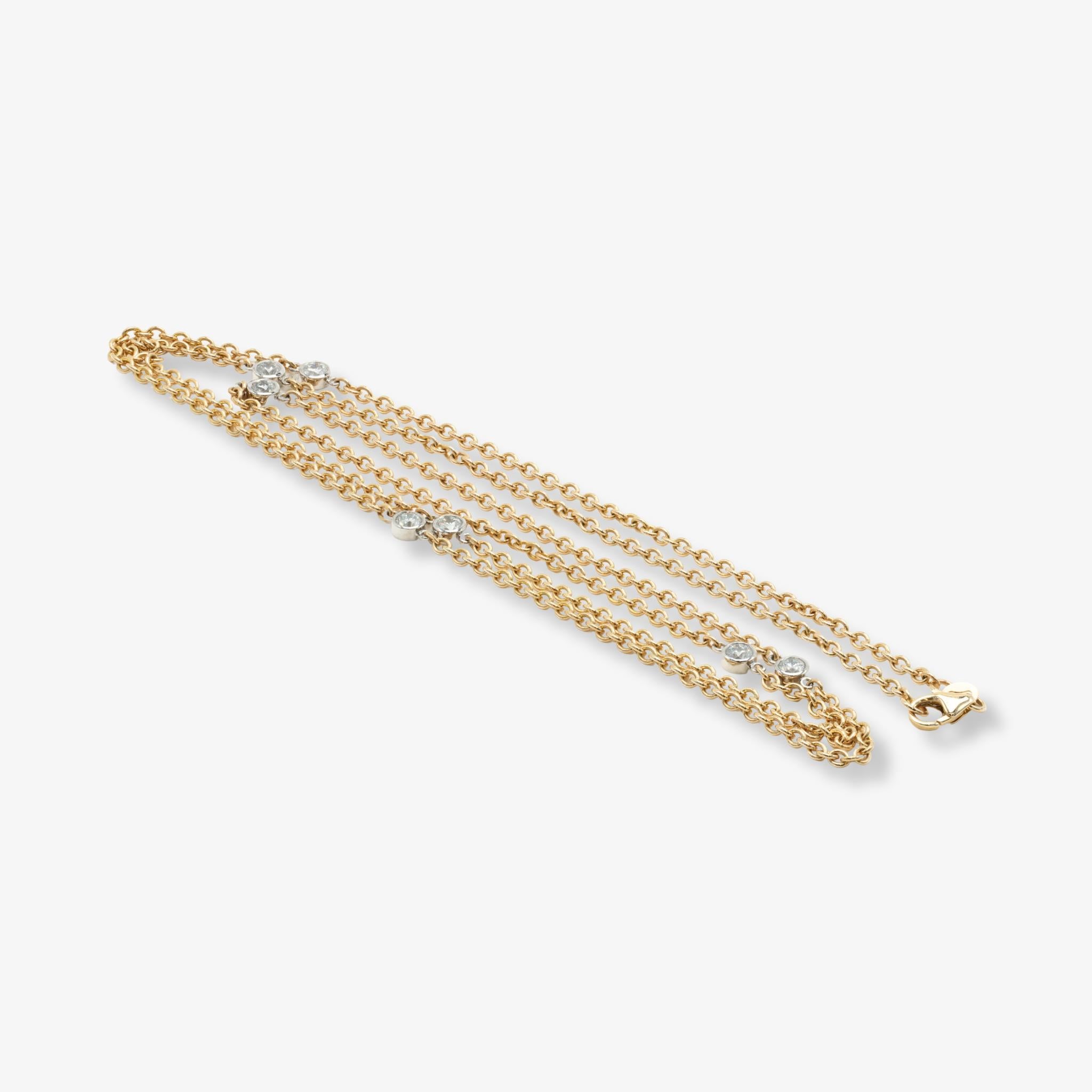 Classic Diamonds by the Yard necklace featuring 7 bezel-set diamonds totaling 1.26 carats, in two tone 14k yellow gold and platinum, 30 inches long, 2.25mm width chain.

A timeless layering essential, this Diamonds by the Yard Necklace showcases