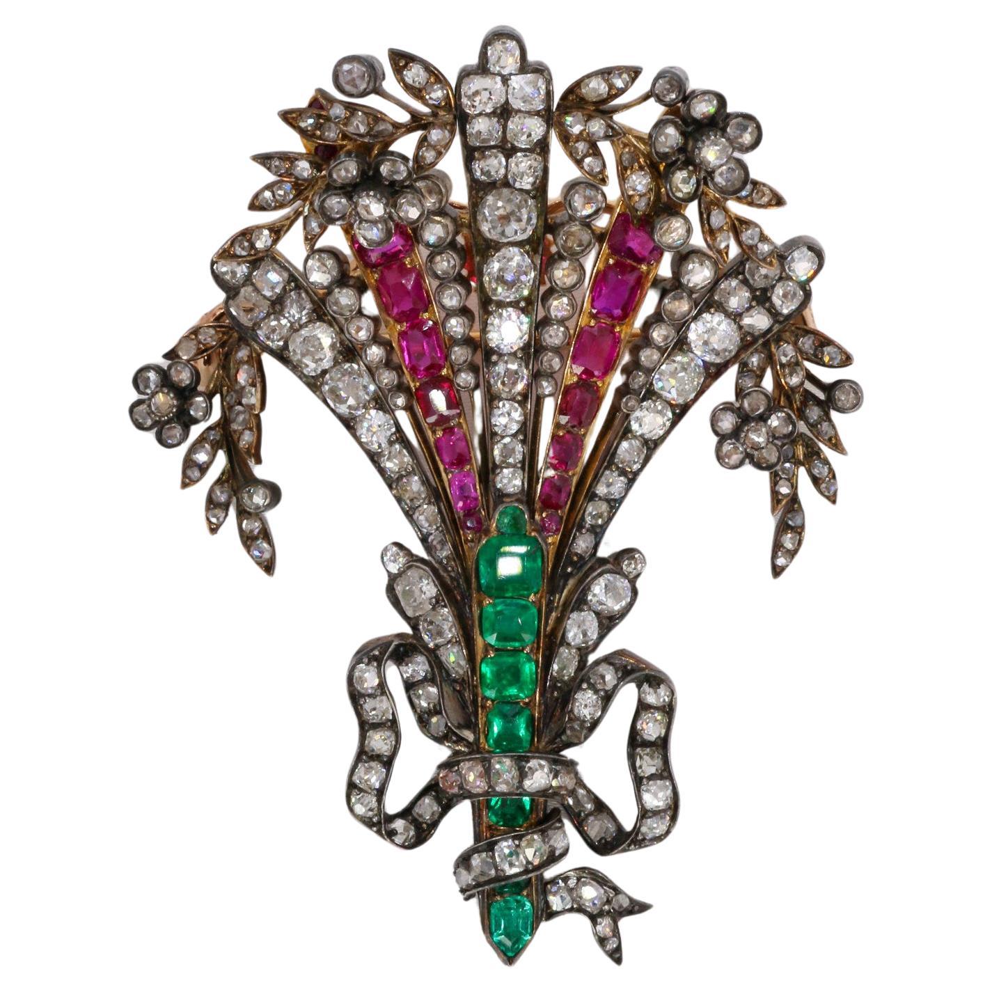 Diamantes, esmeraldas colombianas, rubíes birmanos broche antiguo