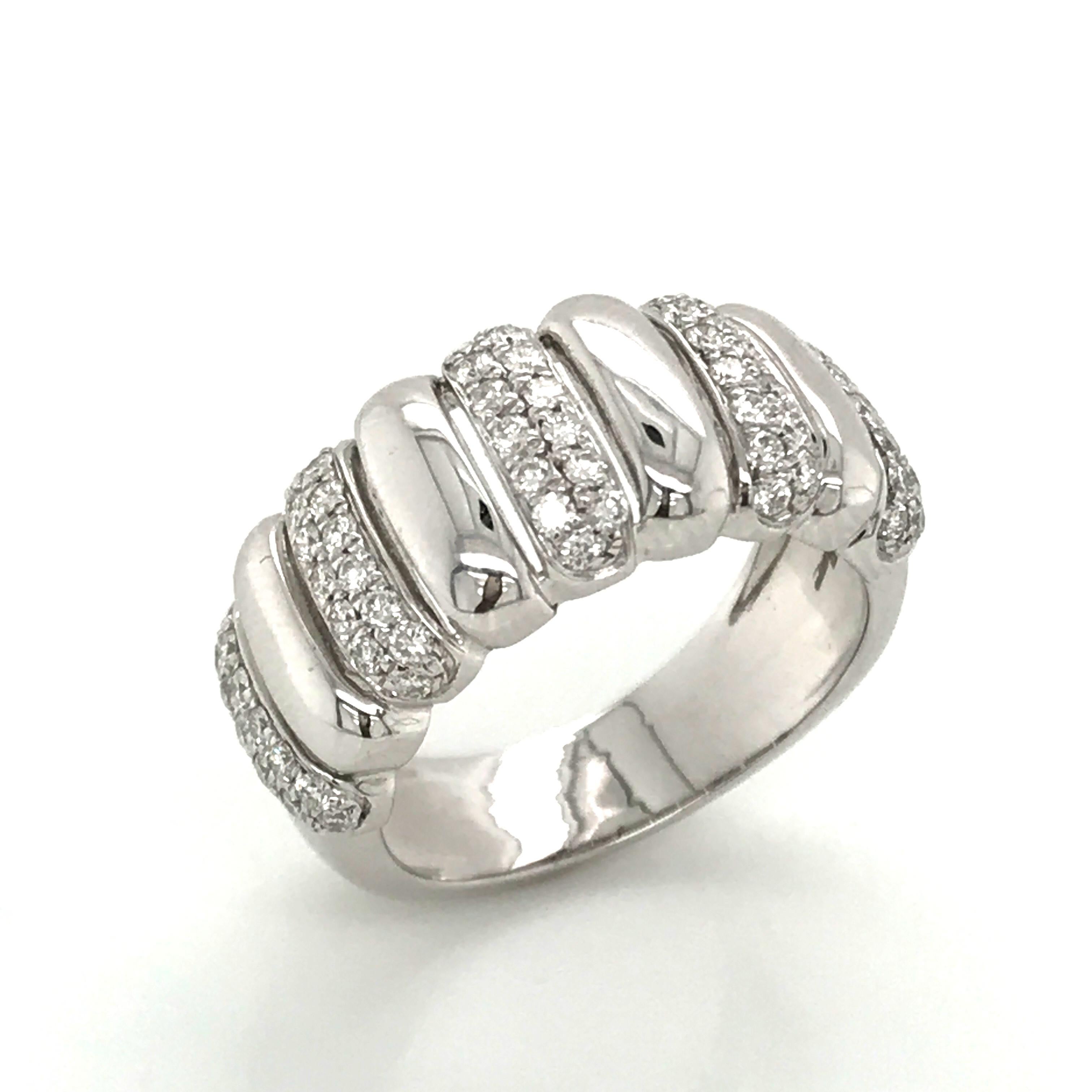 A Color H Diamond Cocktail Ring on a delicate 18k White Gold band. This refined and prestigious piece brings together 65 sparkling Diamonds of an elegant H color and exceptional SI clarity, totaling an impressive 0.650 carat weight. These beautiful