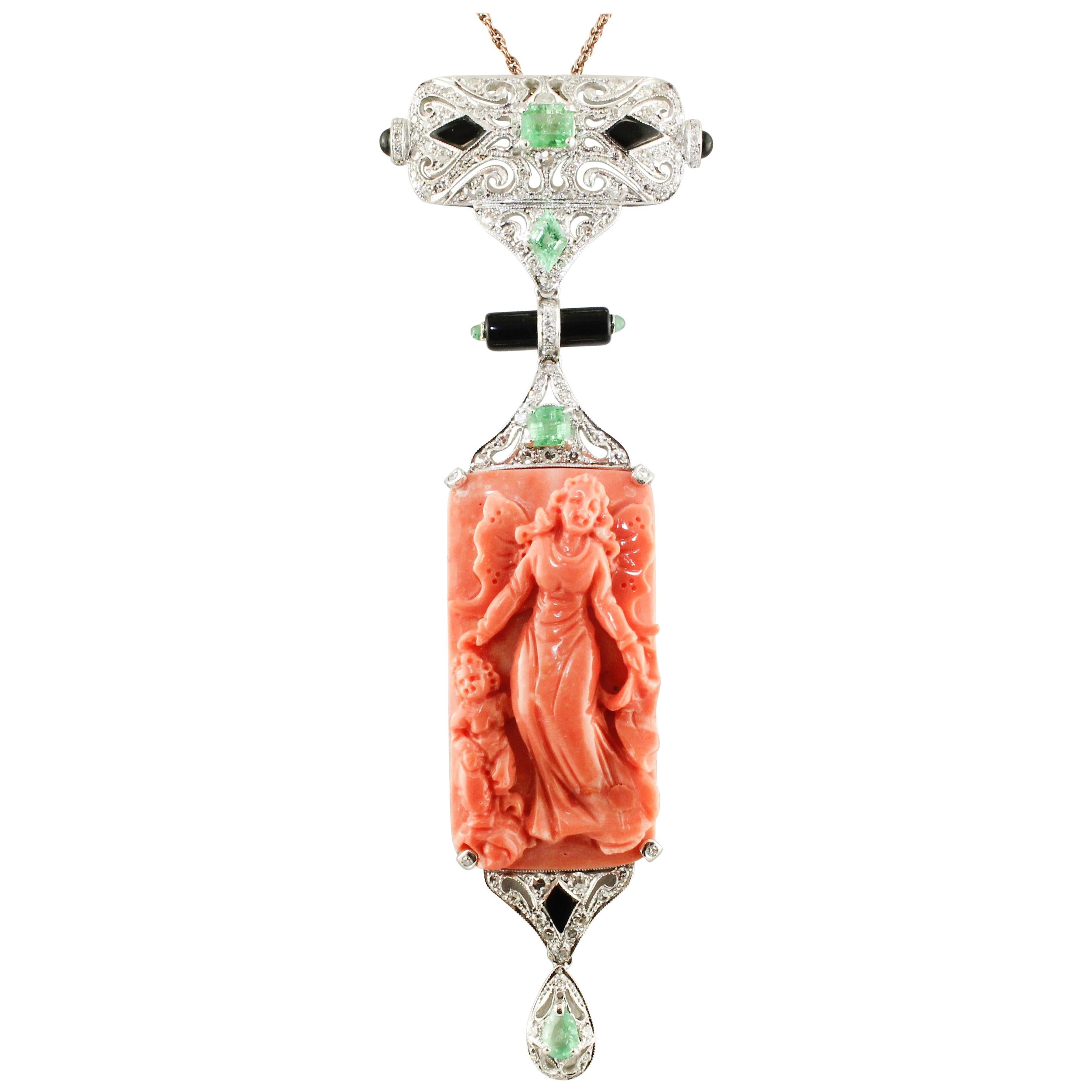 Diamonds, Engraved Body on Orange Coral, Onyx, Emeralds, Platinum Pendant / Brooch