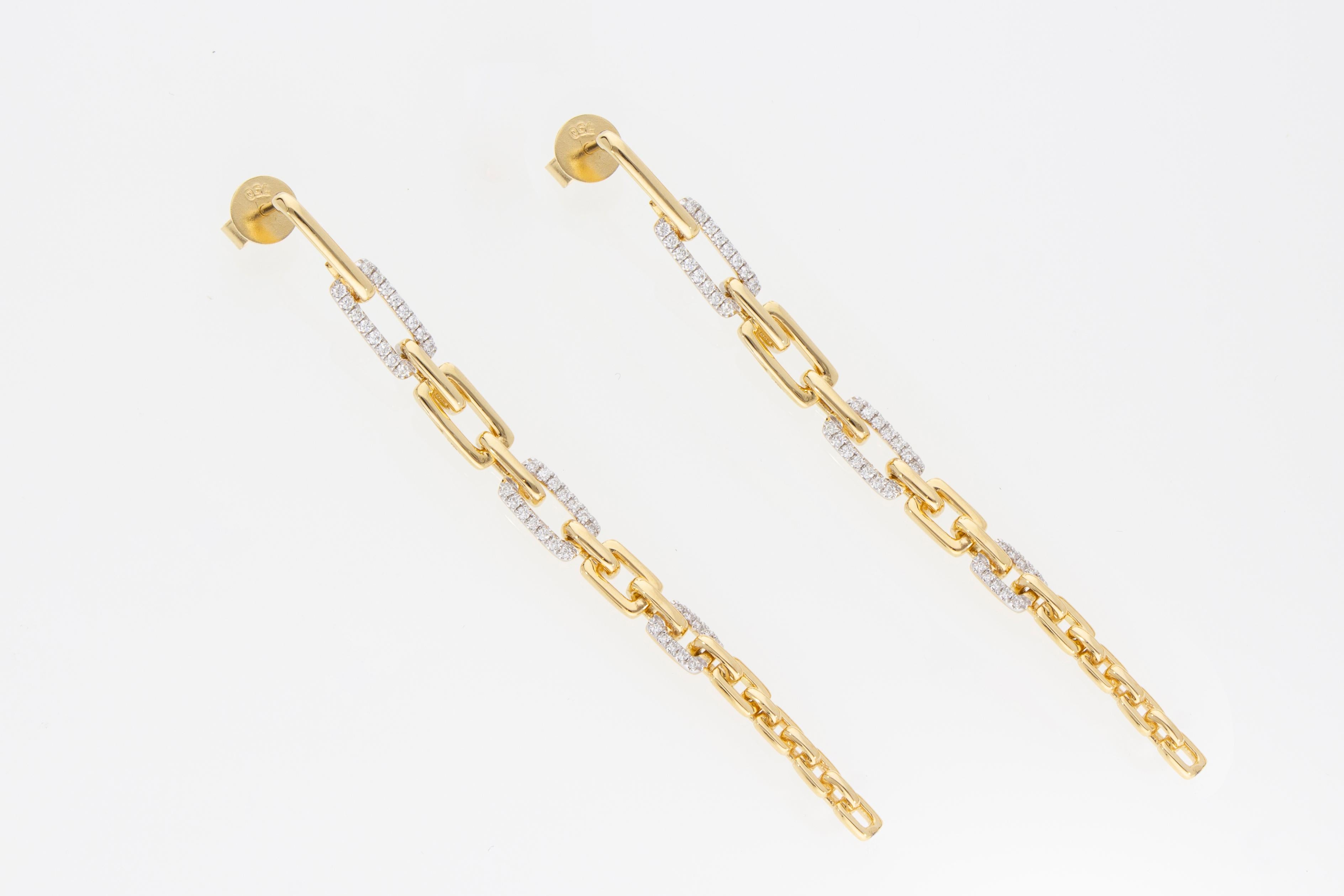 The pendant model earrings are formed by a row of graduated rectangular links. 
The links are alternated in gold and diamonds.
 Diamonds with a total weight of 0.35 ct.
The earrings are in 18 Kt yellow gold.
Total Diamonds Weight: ct. 0.35
Total