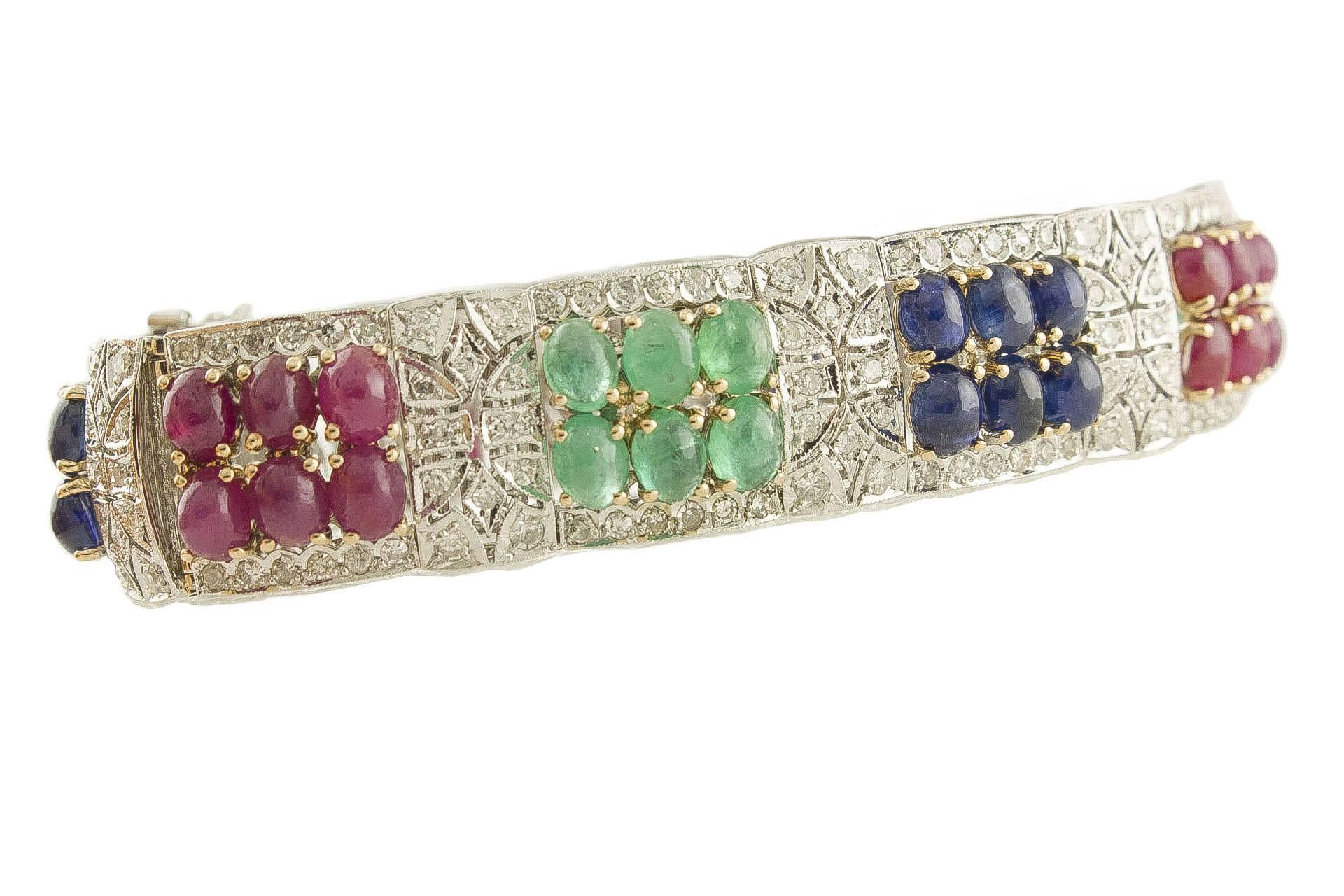 14k white gold bracelet composed of white diamonds, rubies, blue sapphires and emeralds.
Diamonds 4.10 ct 
Rubies, blue sapphires, emeralds 33.13 ct 
Tot.weight 37.80 g
R.F gghch

