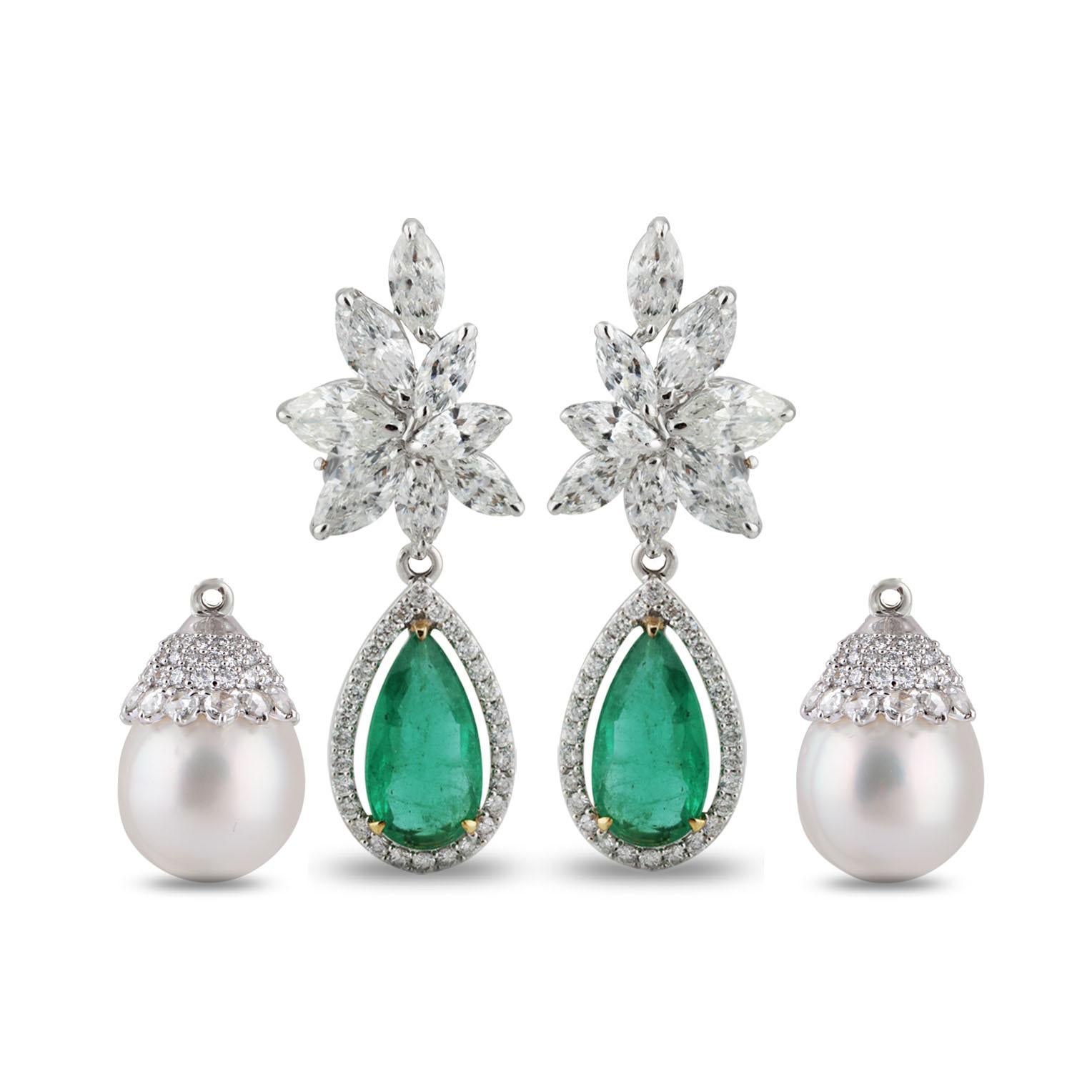 This pair of 18K white gold drop earrings featuring brilliant cut rounds and marquise diamonds and rosecut round diamonds and statement emerald danglers are the definition of old-school luxury. Adding a twist it has a changeable cap with south sea