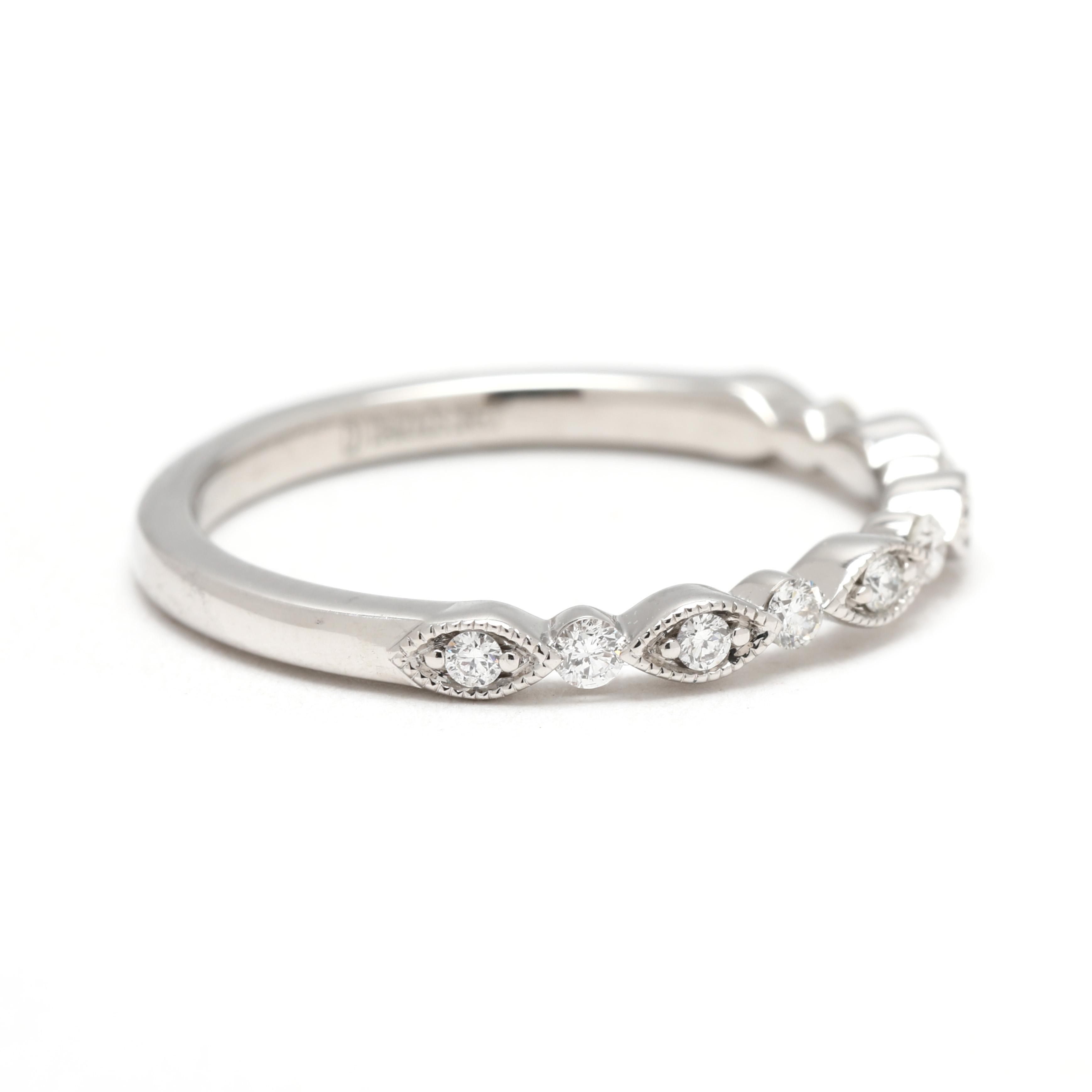 Stones:
diamonds, 11 stones
round brilliant cut
1.5 - 1.75 mm
approximately .20 total carats
G-H color, SI1-2 clarity

Ring Size 6.5

Rise Off Of Finger: 2.2 mm

Width: 2.2 mm

Weight: 1.3 dwts/ 2 grams

Stamps: 