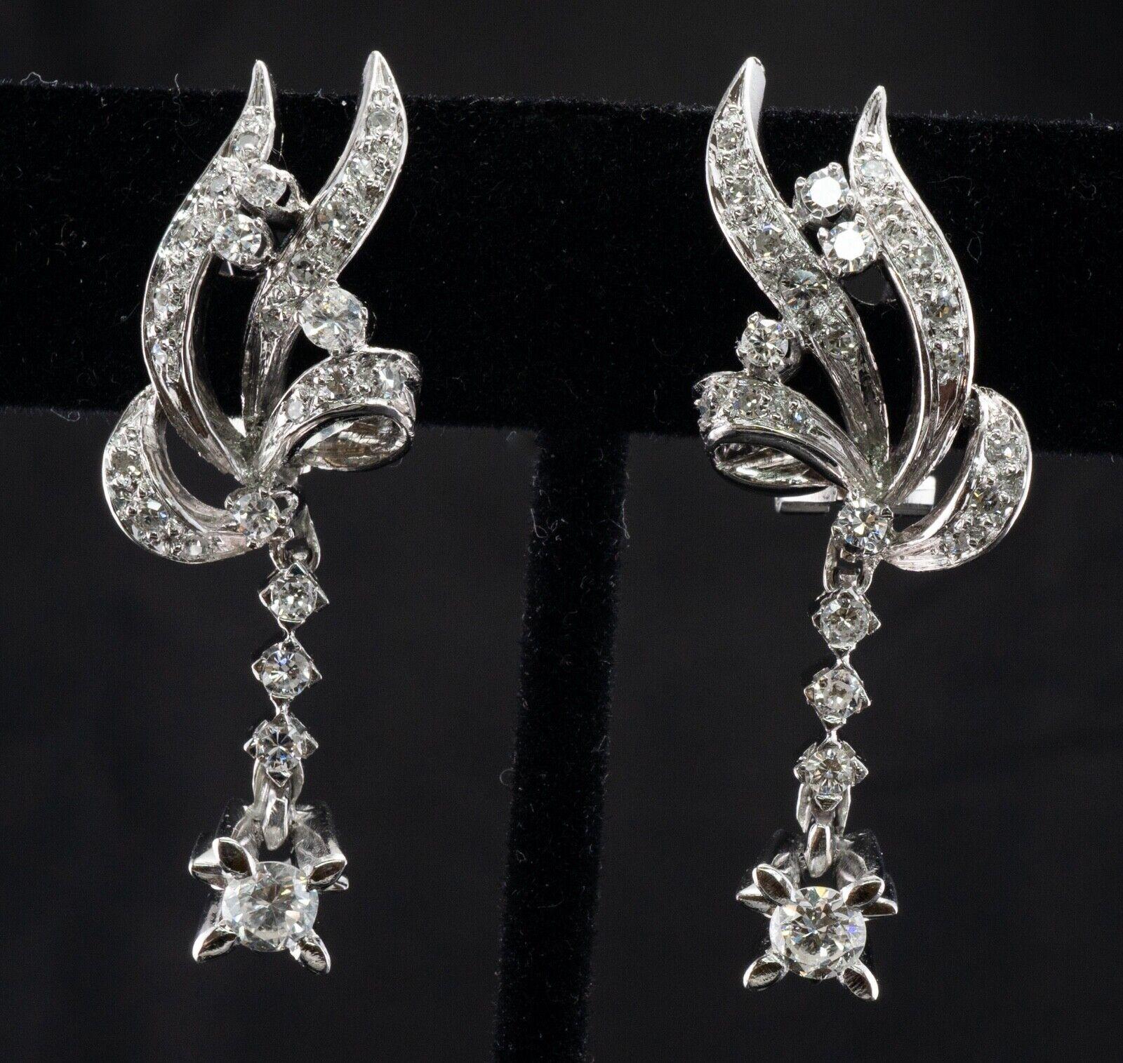 These gorgeous vintage earrings are crafted in solid 18K White Gold and set with natural diamonds. The bigger diamond on the bottom is .25 carat (VS2 clarity, H color). Seven diamonds total .35 carat (VS2 clarity, H color). And sixteen single cut