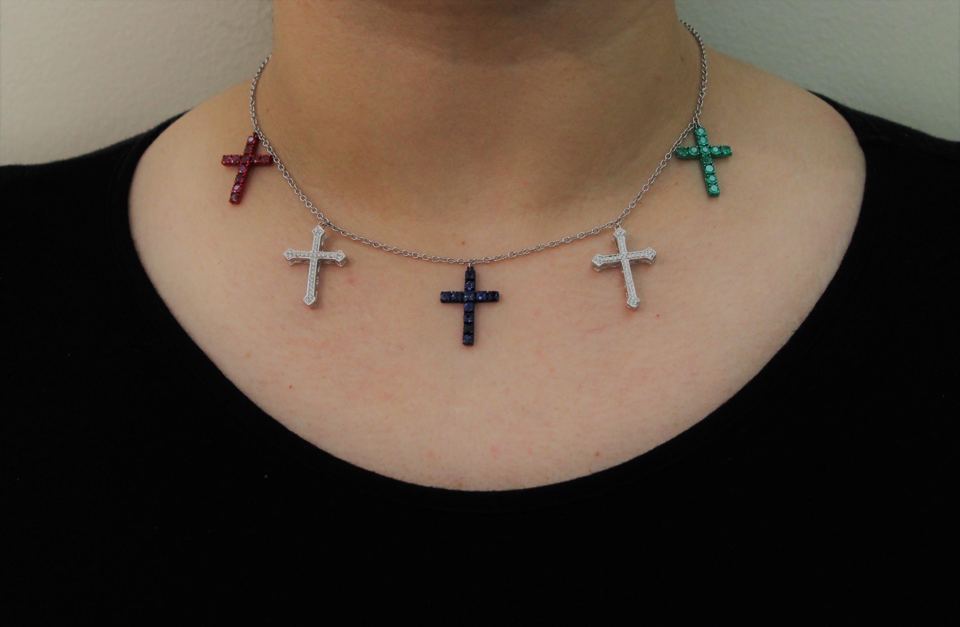 Charms Necklace with different color Cross-Charms:
1 Green E-Coated Emerald Cross is composed of 1.32 Carat Emerald,
1 Red E-Coated Ruby Cross is composed of 1.32 Carat Ruby,
1 Blue E-Coated Sapphire Cross is composed of  1.16 Carat Sapphire,
2