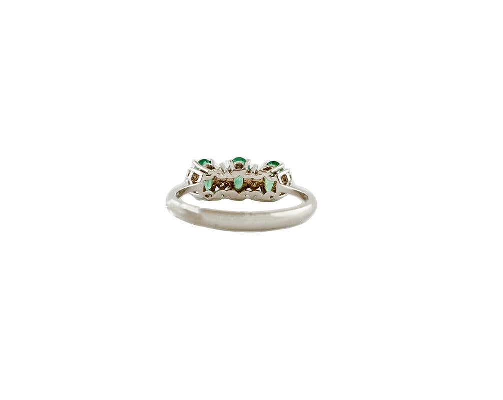 Modern Diamonds, Emeralds, 18 Karat White Gold Ring