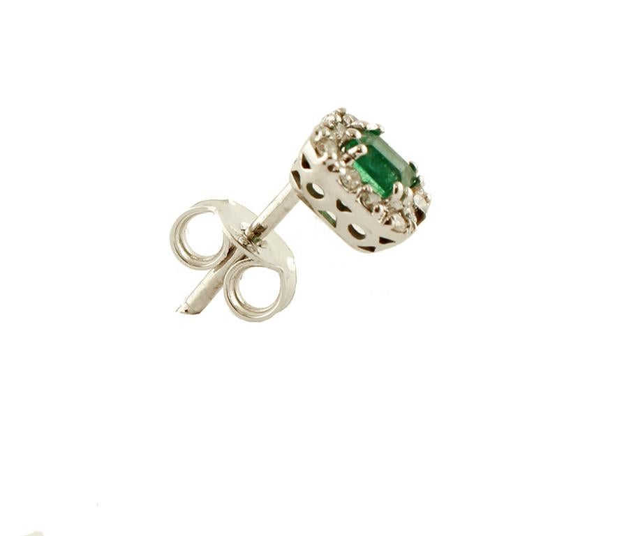 Elegant stud earrings in 18 kt white gold structure mounted with, in the central part, an emerald surrounded by a frame of little white diamonds.
These earrings are totally handmade by Italian master goldsmiths.
Diamonds 0.26 ct, brilliant cut, G