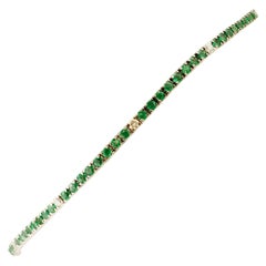 Diamonds, Emeralds 18 Karat White Gold Tennis Bracelet