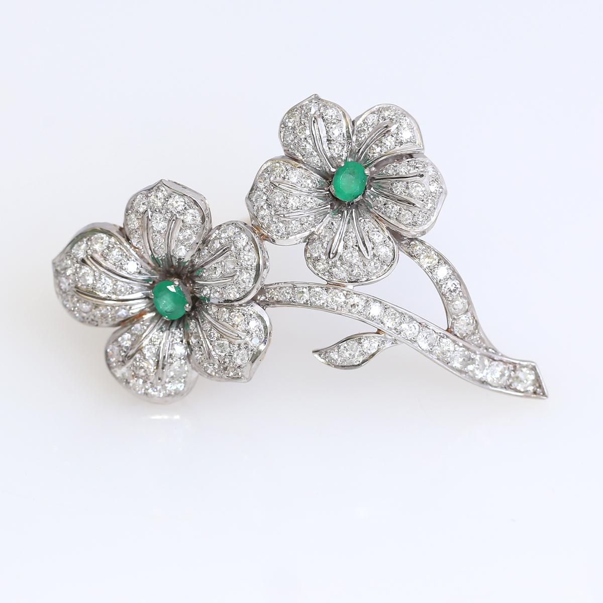 Oval Cut Diamonds Emeralds Flower Brooch 18 Karat White Gold, 1970