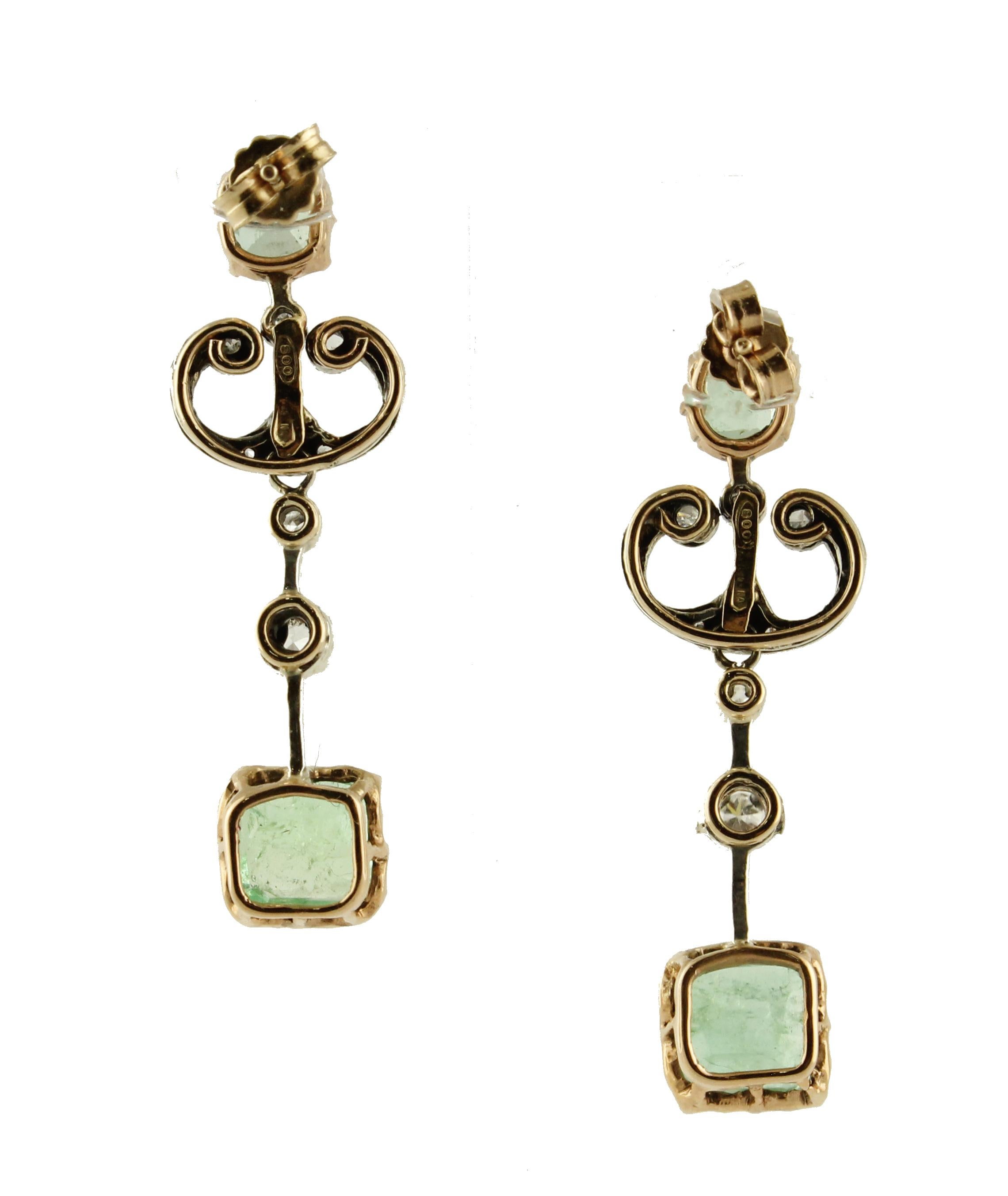 Wonderful old earrings in 9K rose gold and silver structure mounted with 4 unique emeralds and white diamonds 
Diamonds 0.42 ct 
Emeralds 5.82 ct 
Total Weight 6.20 g 
R.F * gifo
Length 3.9 cm 