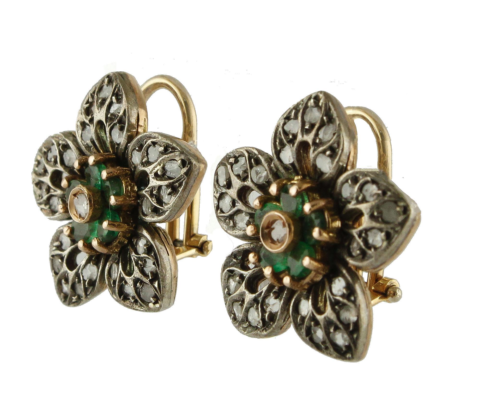 Fabulous flower shape earrings in 14K rose gold and silver structure composed of emeralds and diamond flower in the center and all petals around studded by rose cut diamonds.
Diamonds 0.85 ct 
Emeralds 1.62 ct 
Total Weight 13.70 g 
R.F +