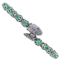 Diamonds, Emeralds, Rubies, Rose Gold and Silver Snake Bracelet.