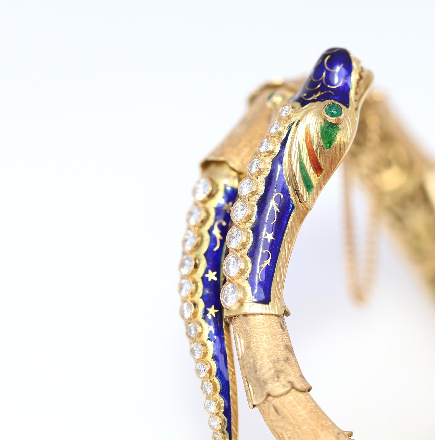 Snake or Dragon flexible Bracelet with Diamonds, Emeralds, fine blue Enamel in 18 karat Yellow Gold.
Outstanding jeweller craft, the whole skin is moving and fits perfectly on the hand. The body is carved to make it rough to touch, amazing finish. 