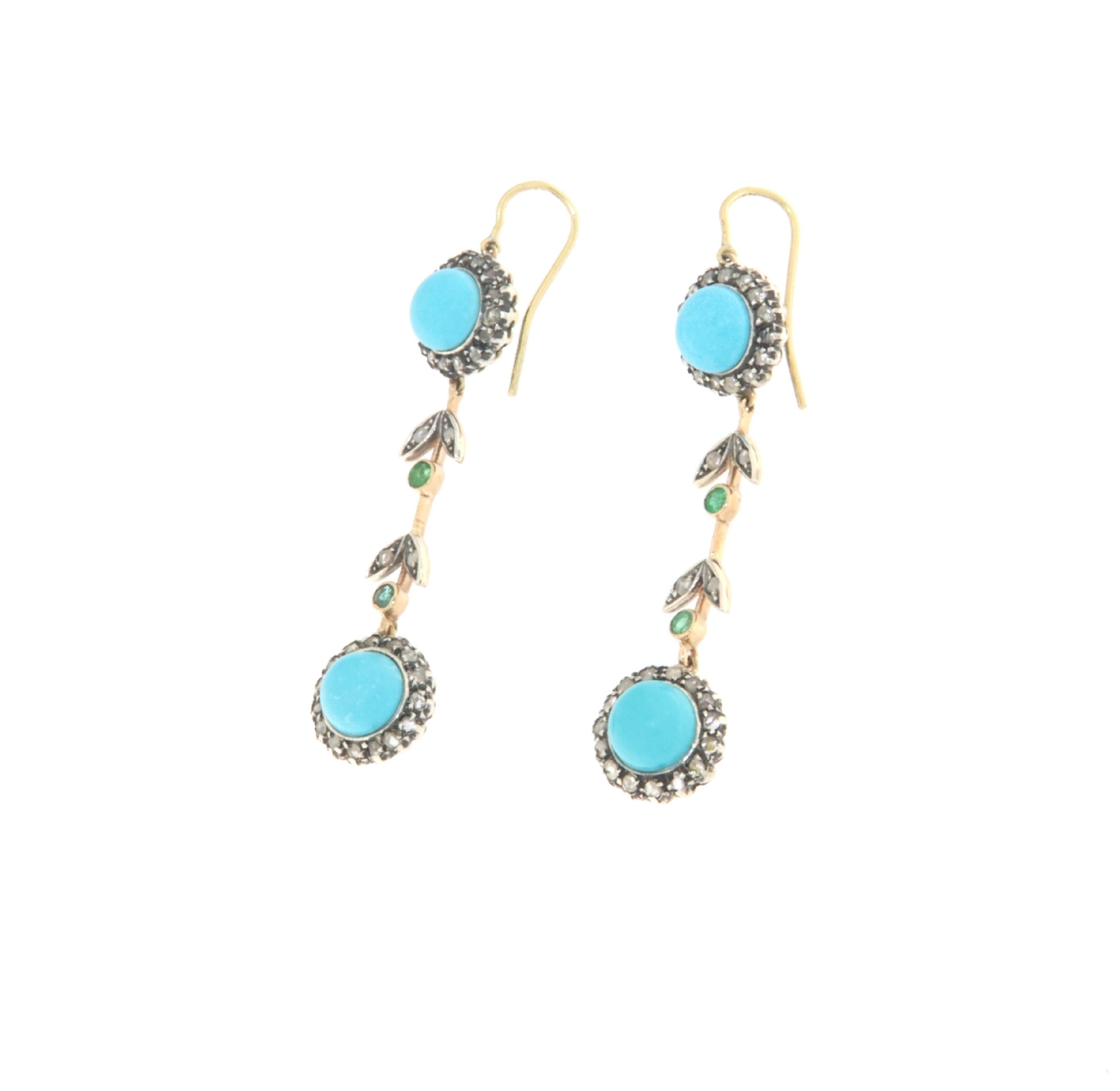 These stunning earrings are a perfect blend of timeless elegance and captivating charm, expertly crafted from 14-karat yellow gold and 800 millesimal silver. Each earring features a combination of antique diamonds, vibrant turquoise, and rich