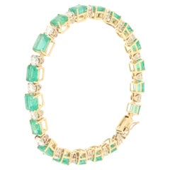 Bracciale tennis in oro giallo 18 carati con diamanti e smeraldi
