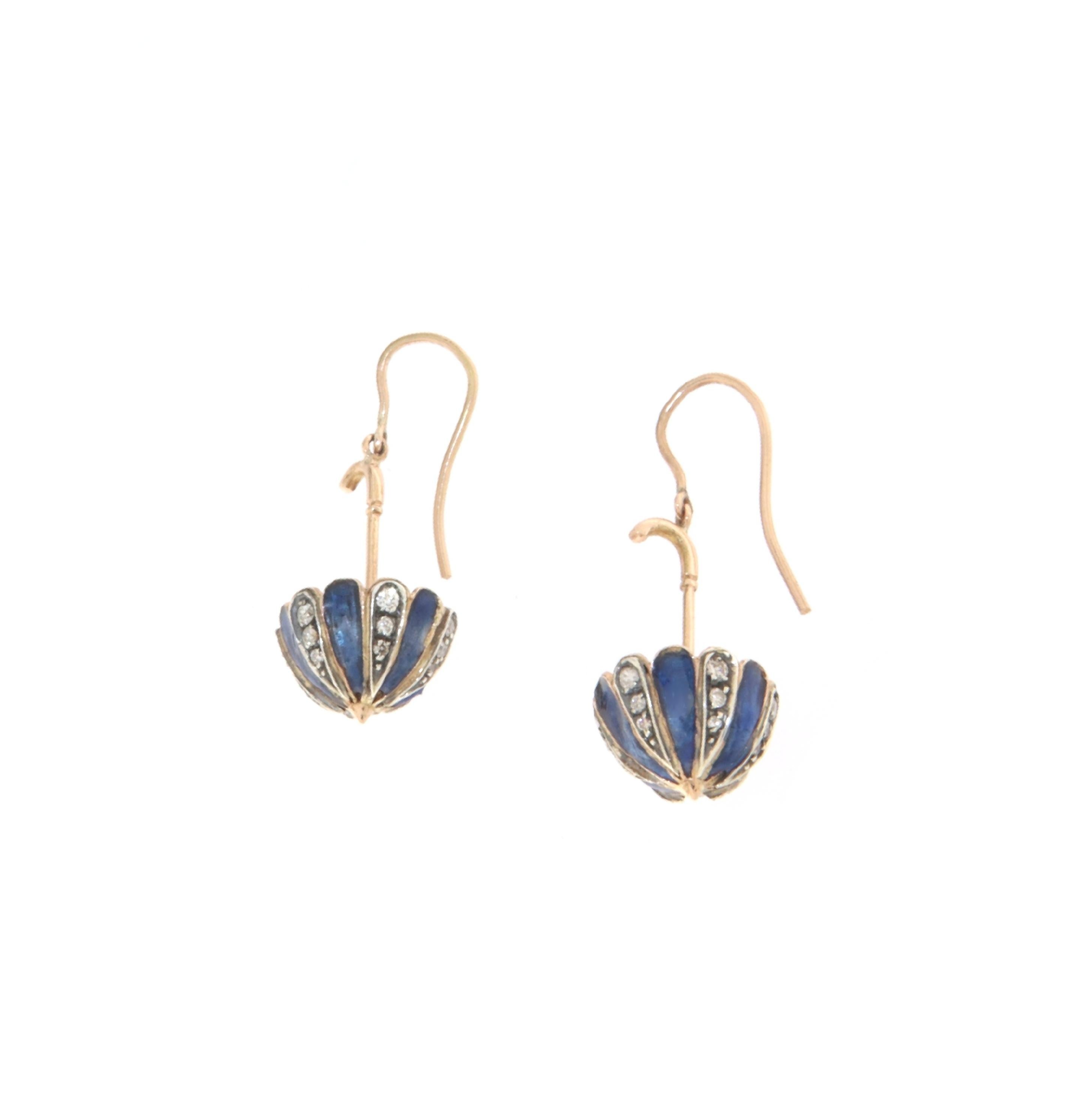 These umbrella-shaped earrings are crafted in 14-carat yellow gold and 800 thousandths silver, blending timeless elegance with meticulous craftsmanship. The unique umbrella design adds a distinctive charm, perfect for those looking to wear a piece