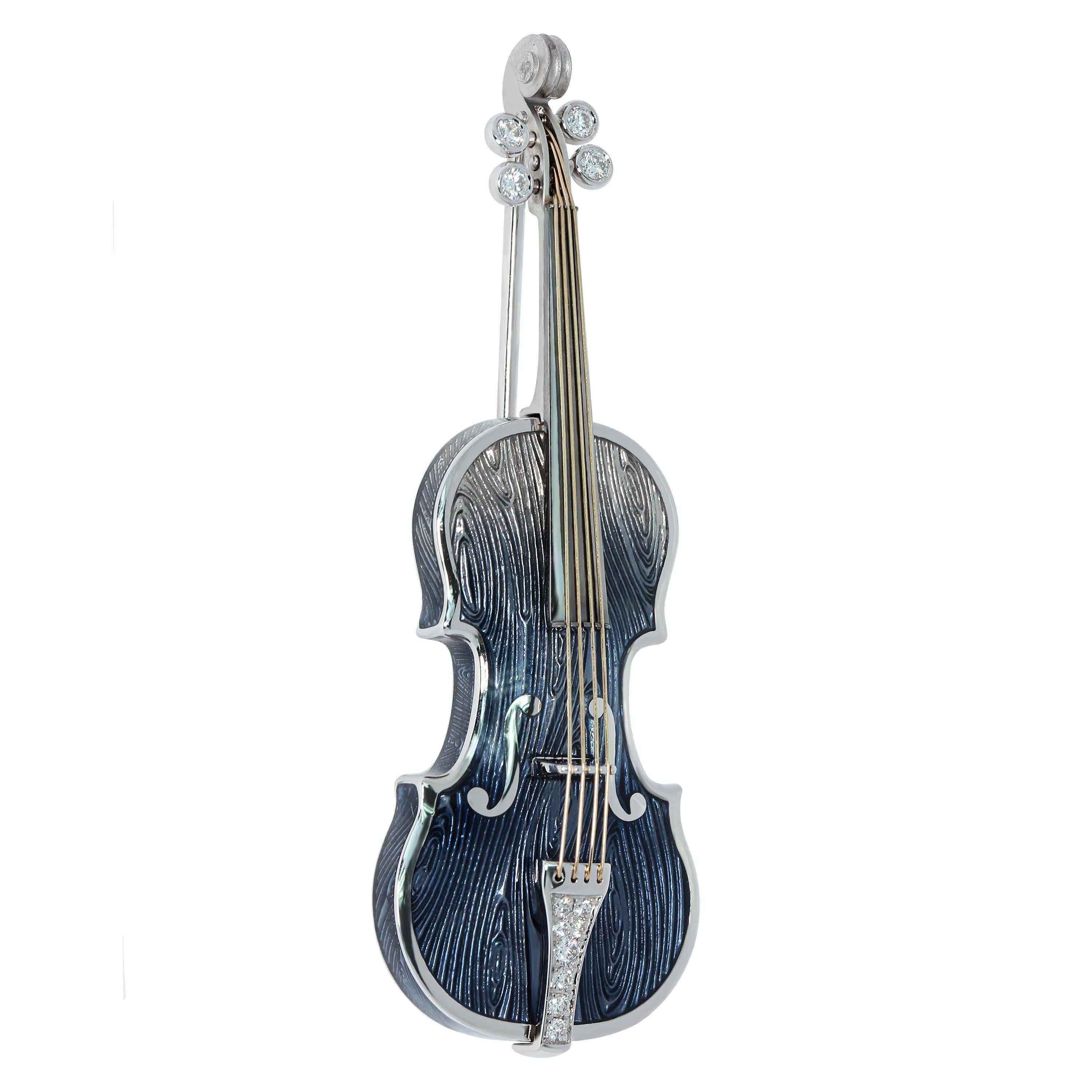 Diamonds Enamel 18 Karat White Gold Blue Violin Brooch
Violin is probably the best known and most widely distributed musical instrument in the world.
And it’s form is completely striking with its grace.
Its strings are hitched to tuning pegs and a
