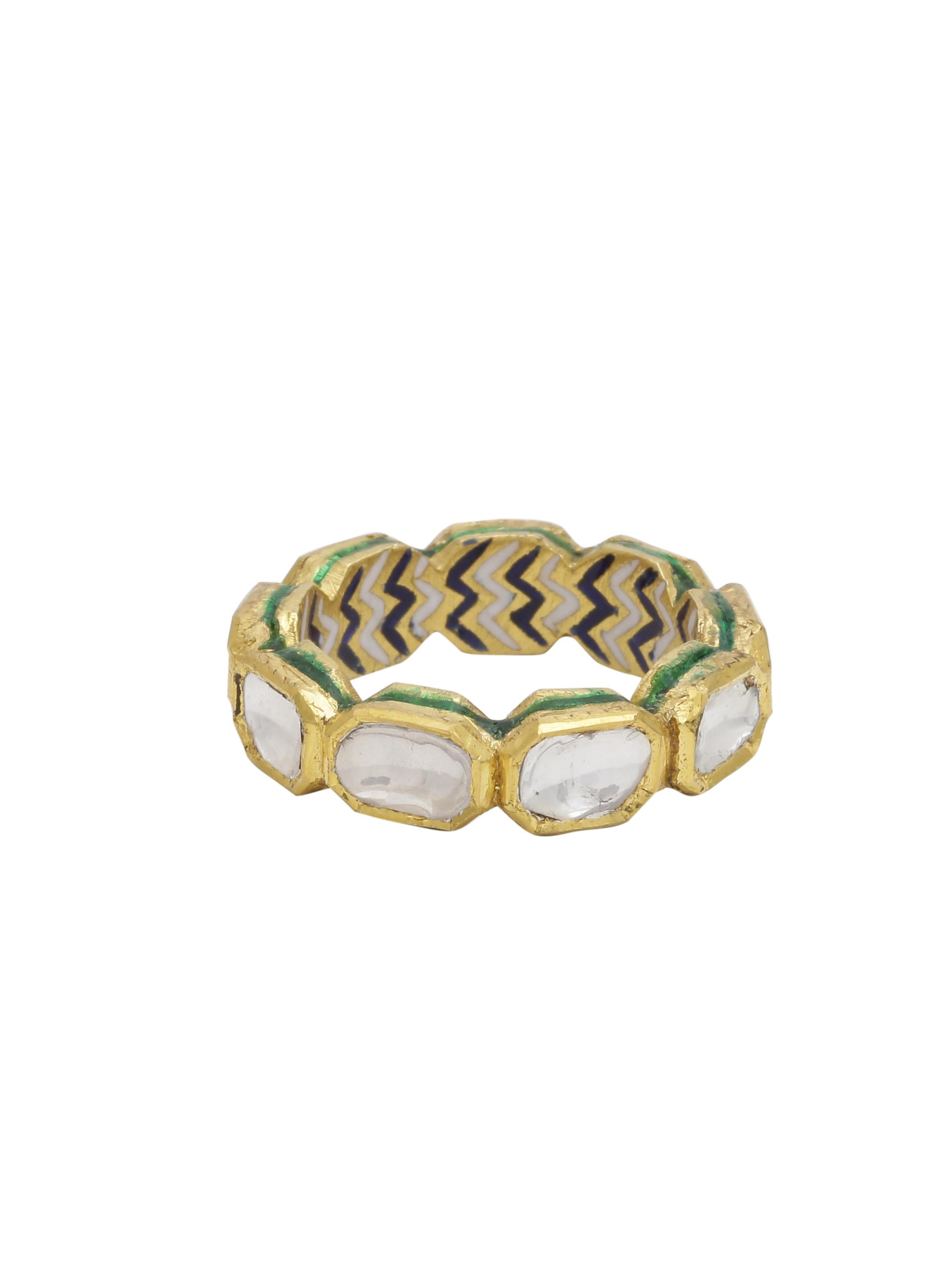 A blend of Indian Artistic jewellery and the classic eternity band.
The beautiful ring is Handmade in 18K Gold and has 1.40 carats of diamonds with enamel work inside and on the side. Each Diamond is set by hand using 'Kundan' which is the purest