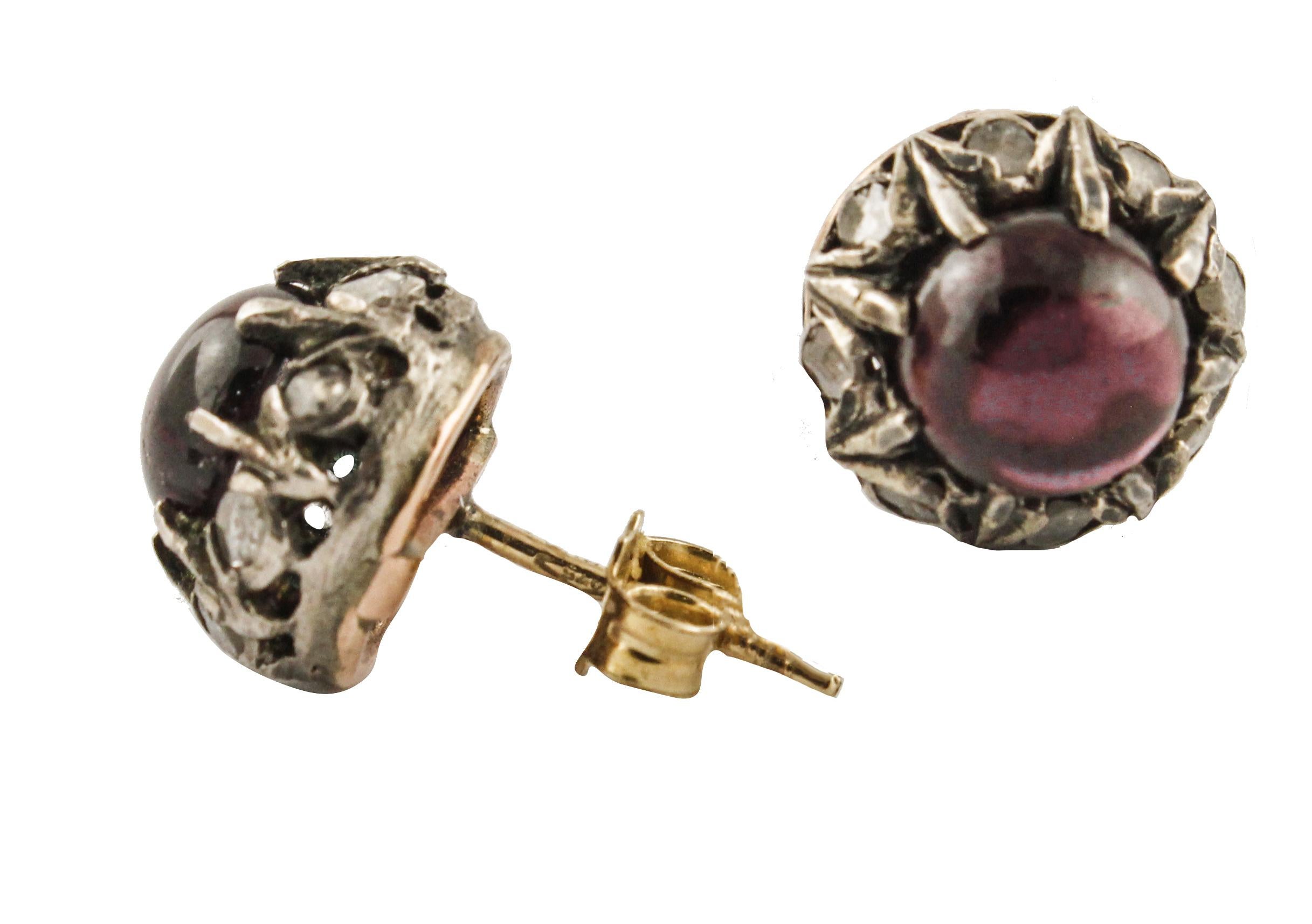 Stud earrings in 9K rose gold and silver structure mounted with garnets in the center and a diamonds crowns around them.
Diamonds 0.42 ct 
Garnets 3.70 ct
Total Weight 4 g
R.F + fee
Dimentions 1.1 cm X 1.1 cm 

For any enquires, please contact the